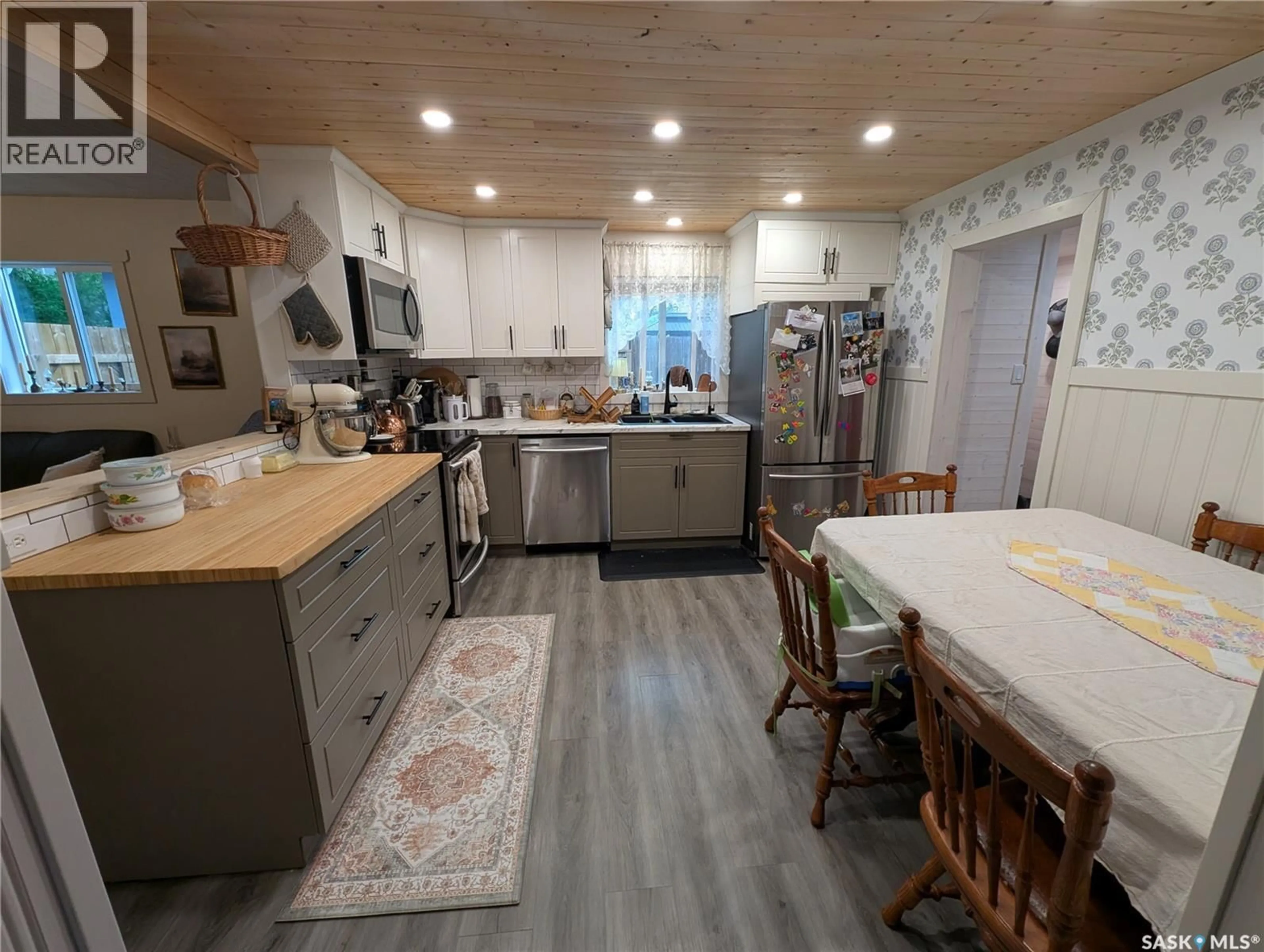 Open concept kitchen, wood/laminate floor for 2009 7TH STREET, Rosthern Saskatchewan S0K3R0