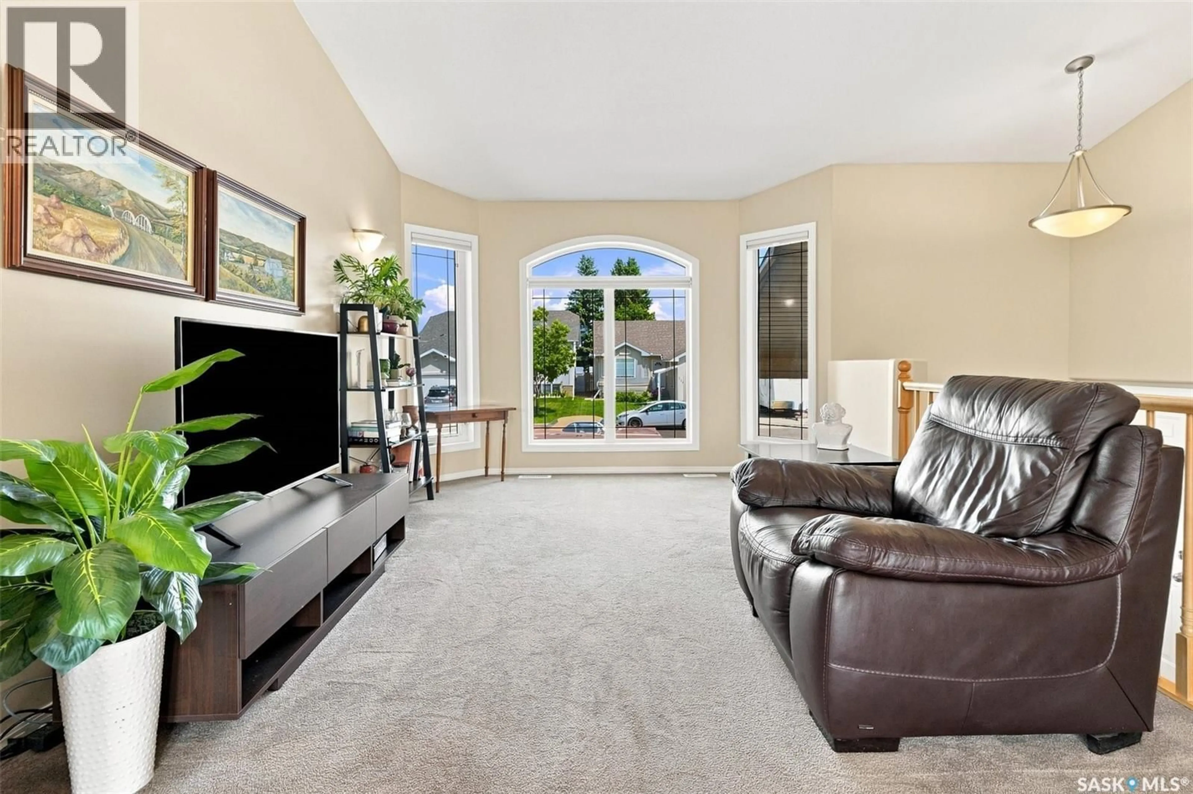 Living room with furniture, carpet floor for 238 BLACKBURN CRESCENT, Saskatoon Saskatchewan S7V1E9