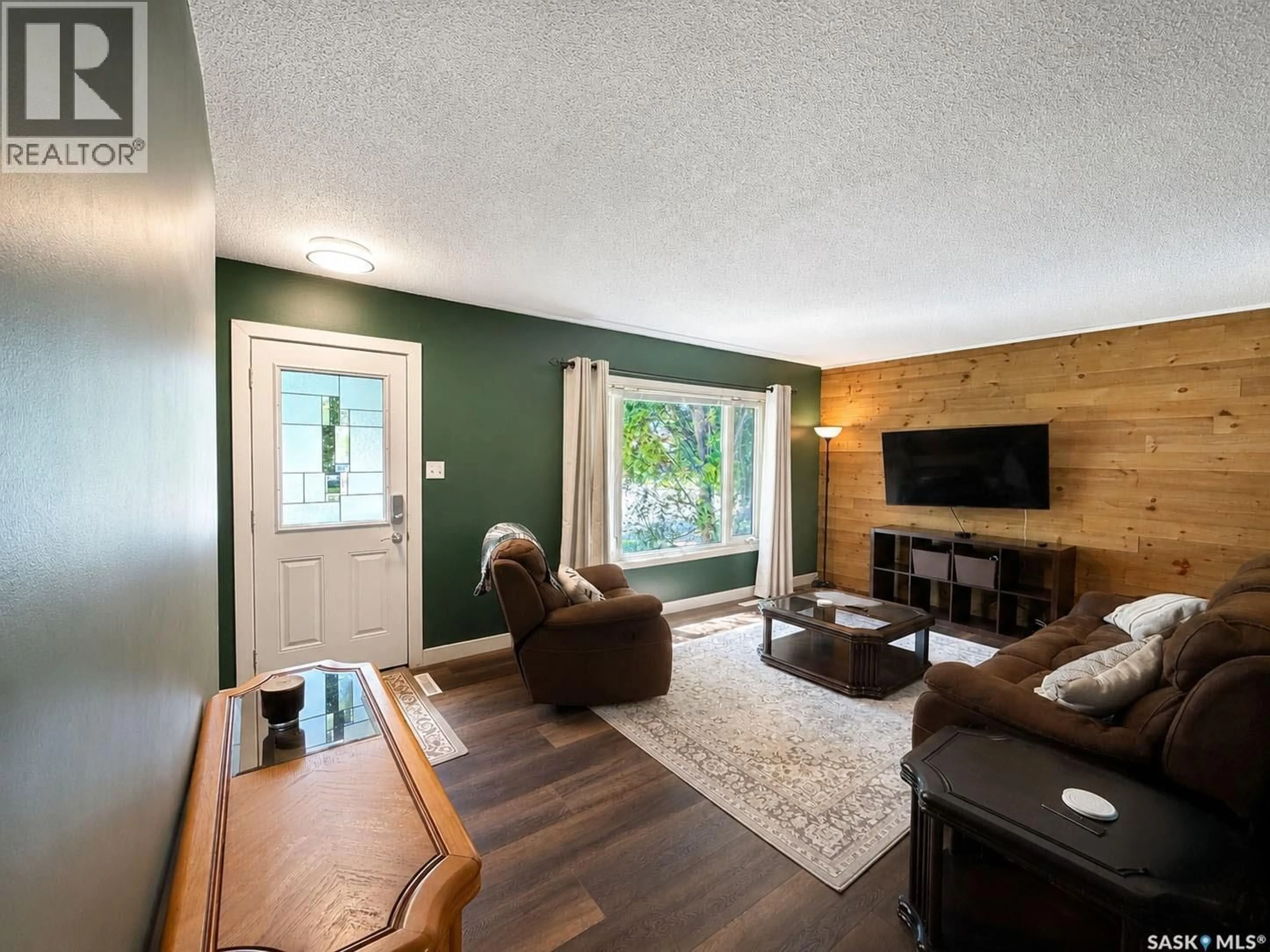 Living room with furniture, wood/laminate floor for 984 BRADSHAW PLACE, Prince Albert Saskatchewan S6V2P4