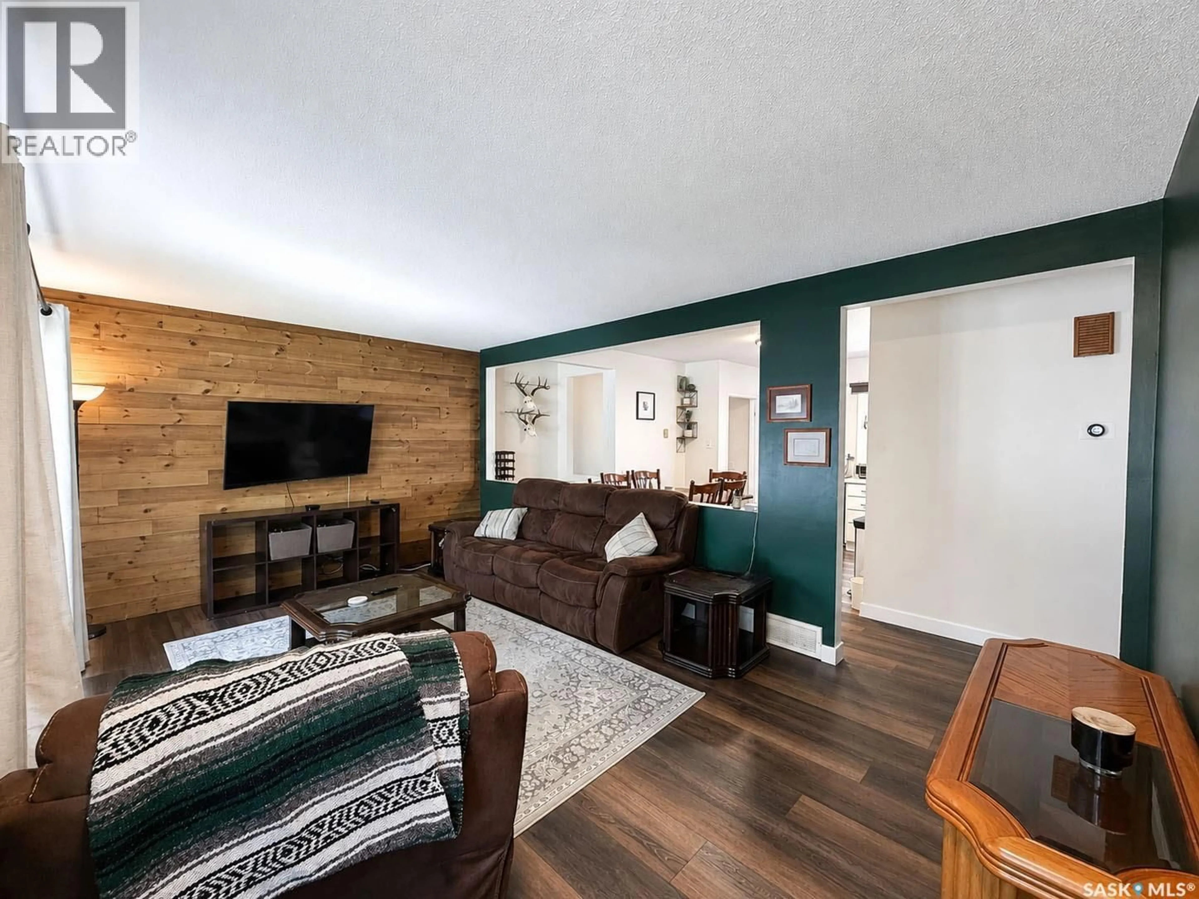 Living room with furniture, wood/laminate floor for 984 BRADSHAW PLACE, Prince Albert Saskatchewan S6V2P4