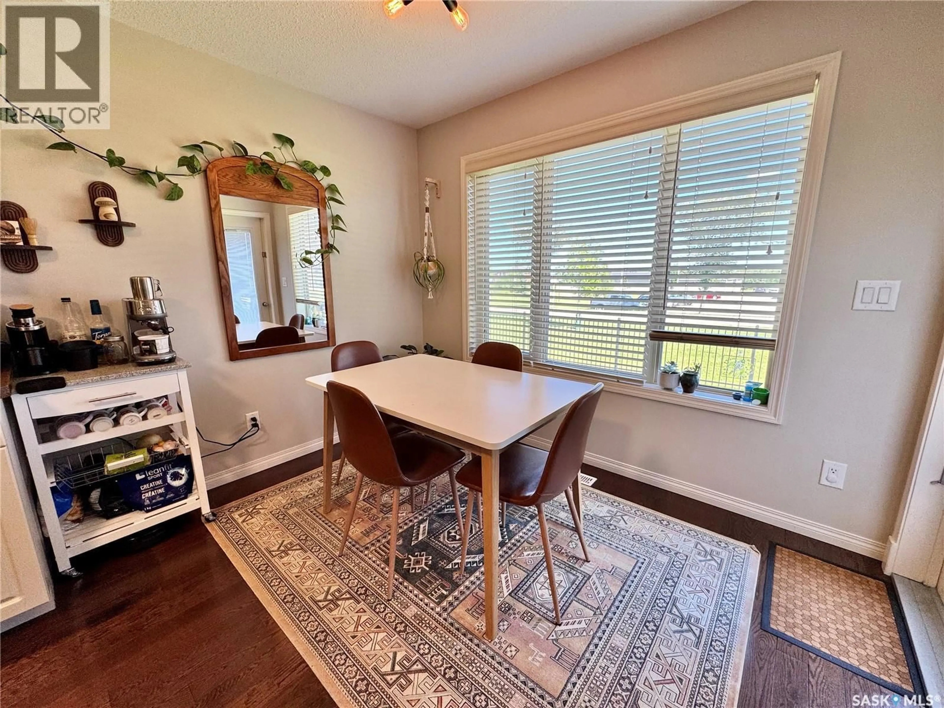 Dining room, wood/laminate floor for 18 1600 MUZZY DRIVE, Prince Albert Saskatchewan S6X0A2