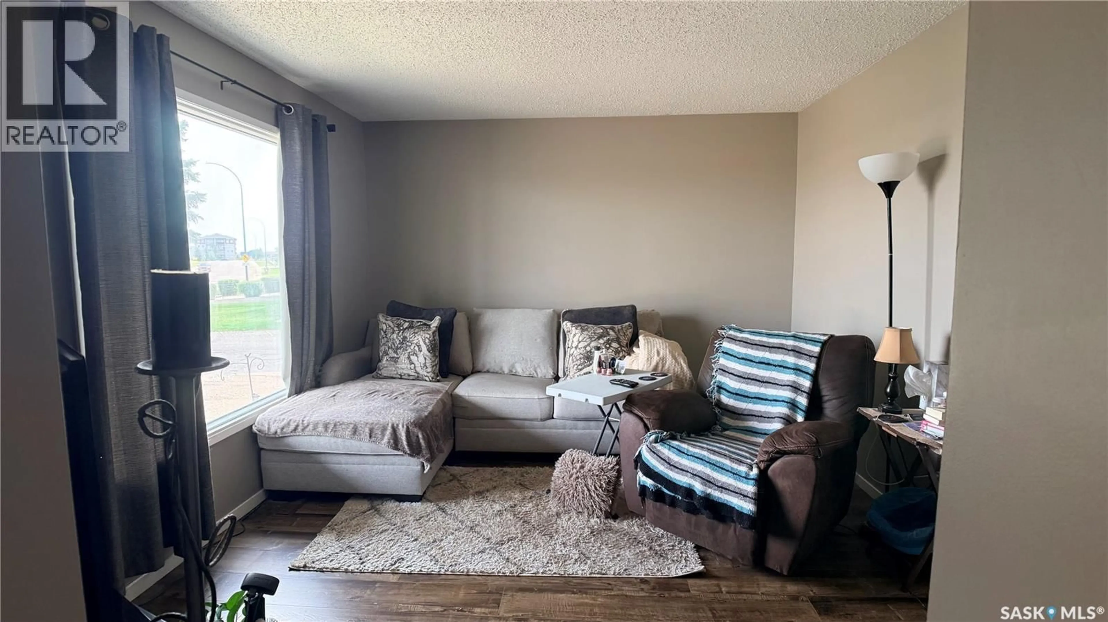 Living room with furniture, unknown for 412 HERITAGE DRIVE, Estevan Saskatchewan S4A2N4