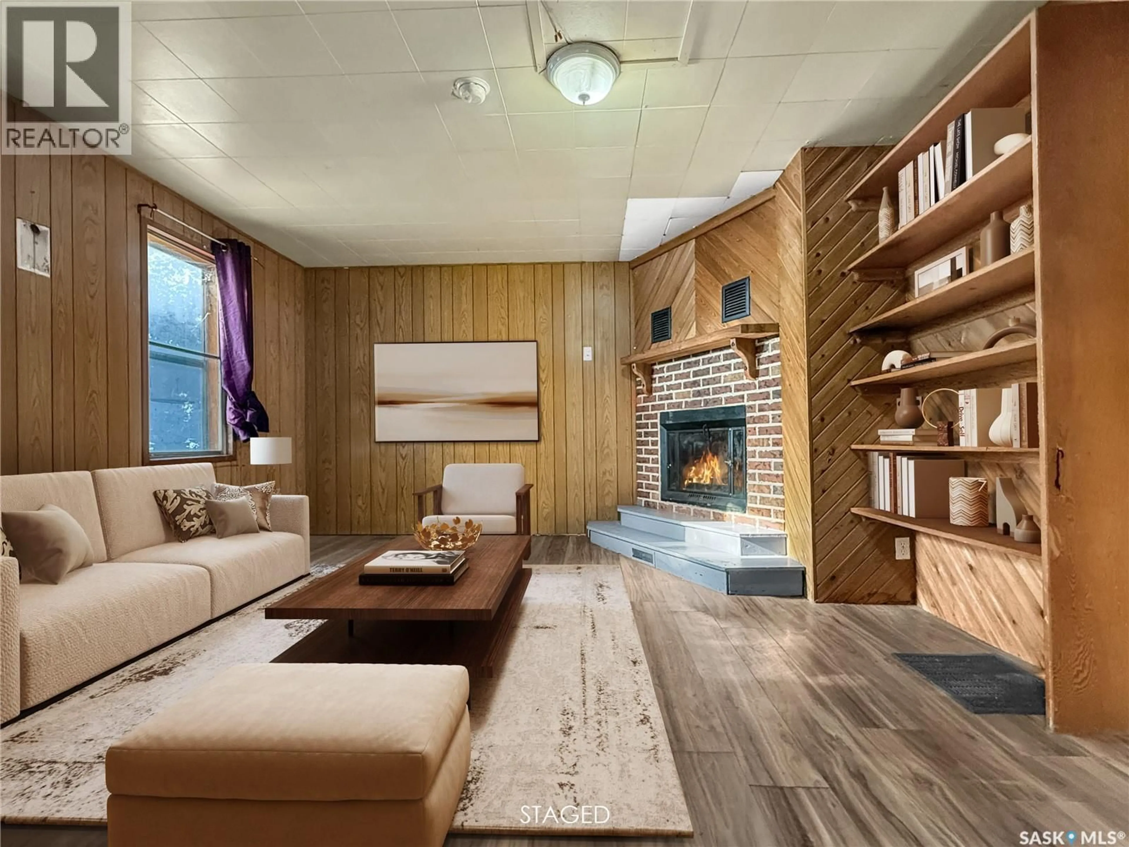 Living room with furniture, wood/laminate floor for 359 6TH AVENUE, Swift Current Saskatchewan S9H3P2