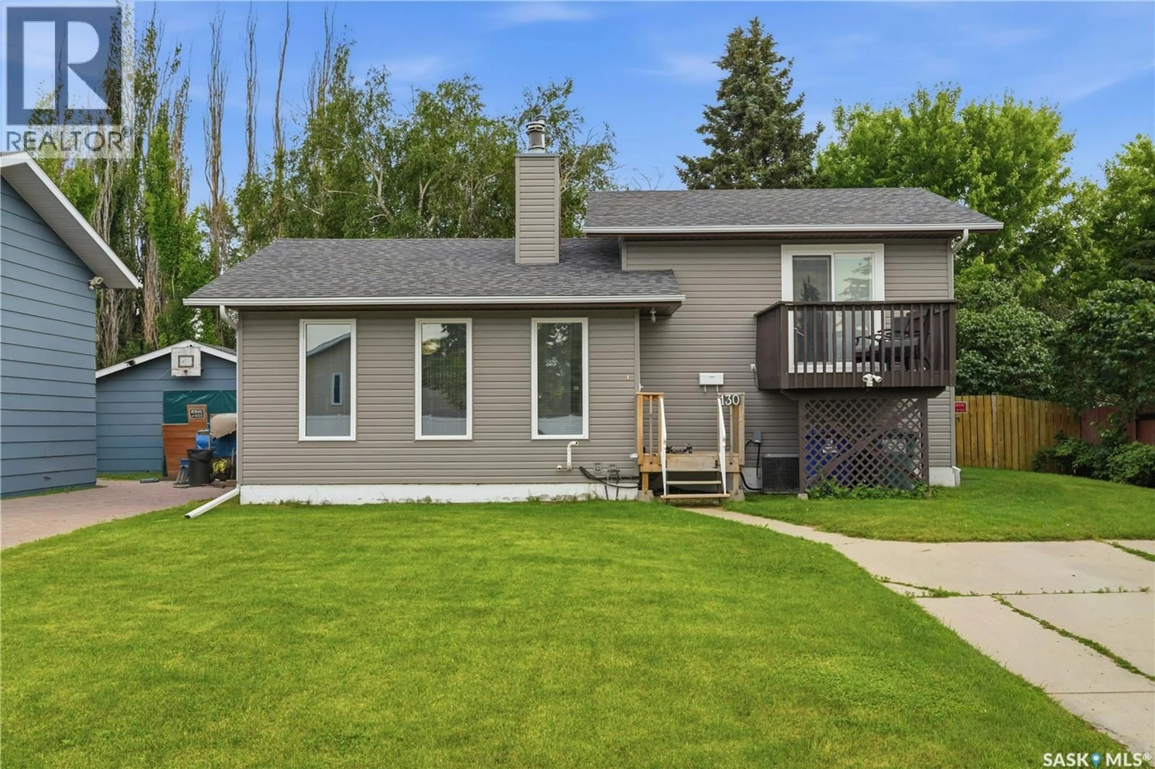 Home with vinyl exterior material, street for 130 FLAVELLE CRESCENT, Saskatoon Saskatchewan S7L6L2