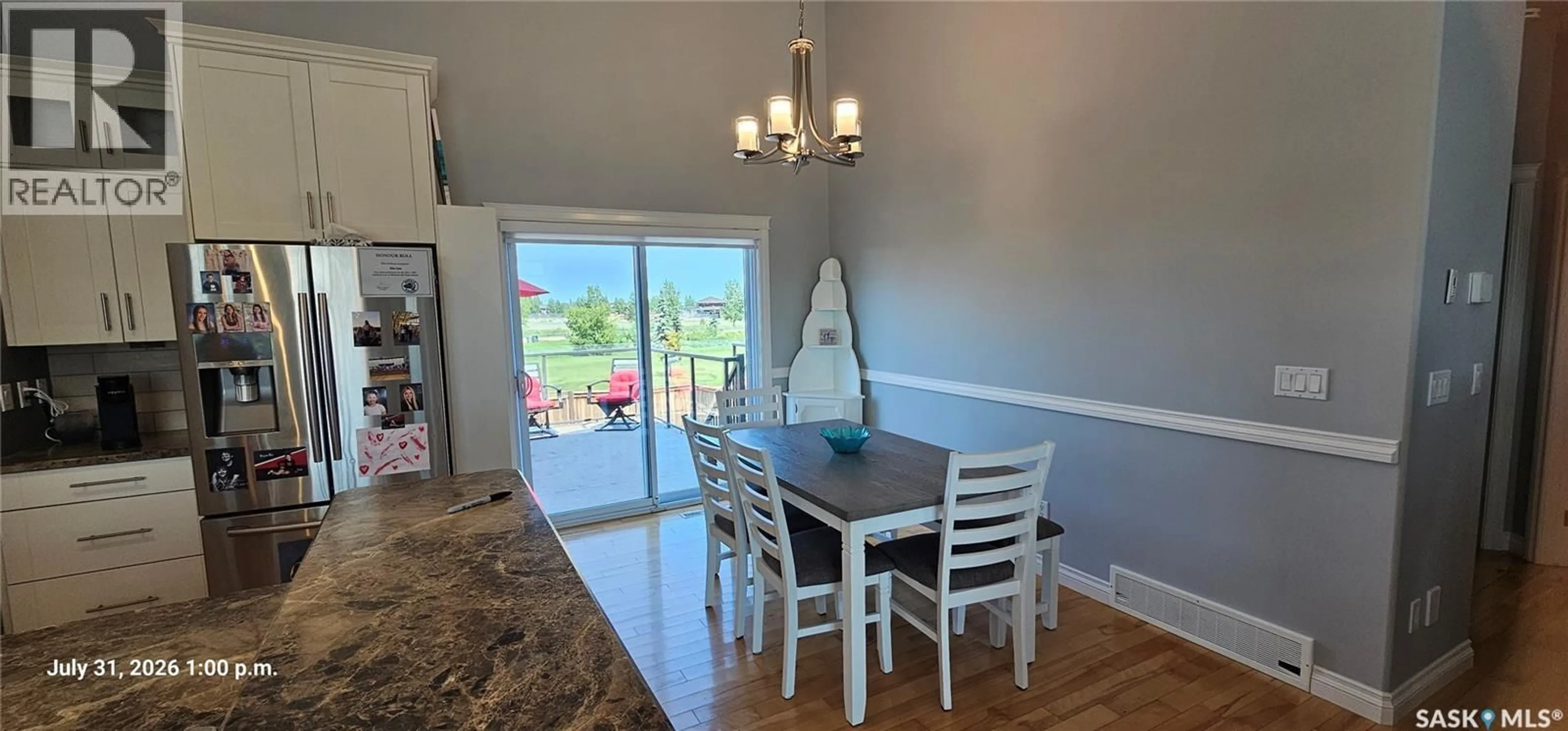 Dining room, wood/laminate floor for 128 KINSMEN CRESCENT, Martensville Saskatchewan S0K0A2
