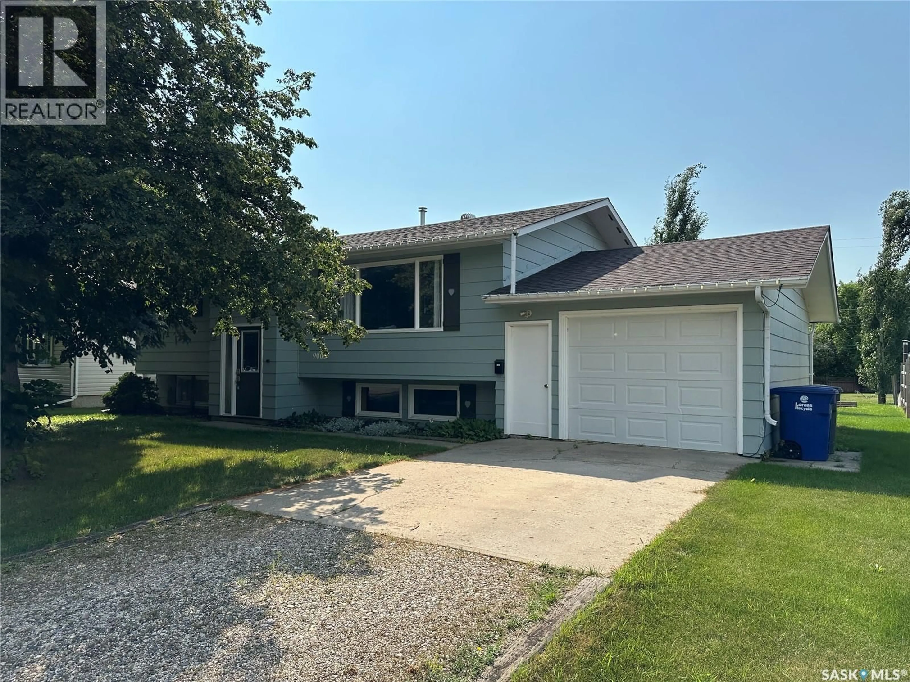 Home with vinyl exterior material, street for 9005 5TH STREET, Rosthern Saskatchewan S0K3R0