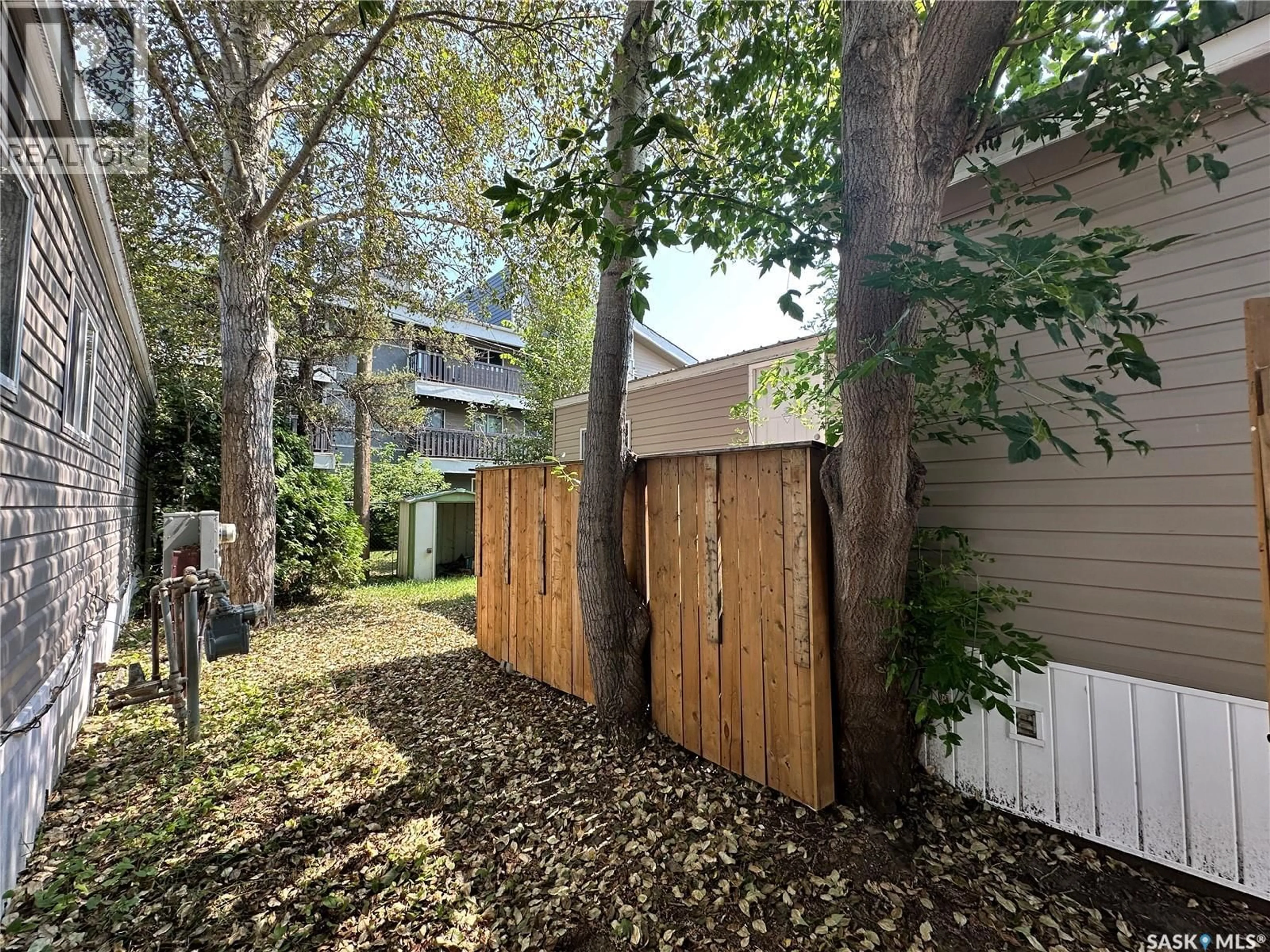 A pic from outside/outdoor area/front of a property/back of a property/a pic from drone, forest/trees view for 7 321 DUNLOP STREET, Saskatoon Saskatchewan S7N2P7