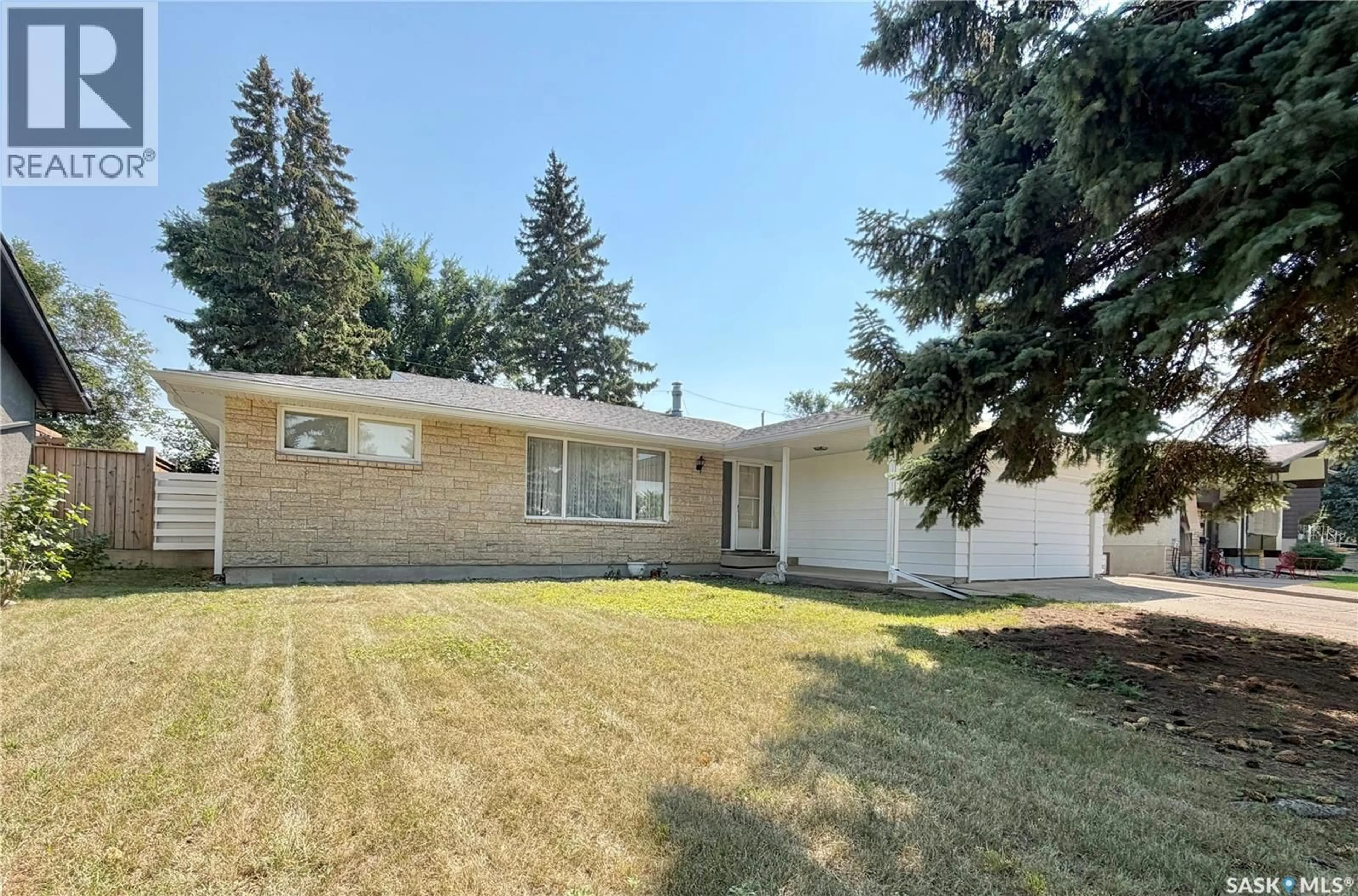 Home with vinyl exterior material, street for 1247 GORDON ROAD, Moose Jaw Saskatchewan S6H3E3