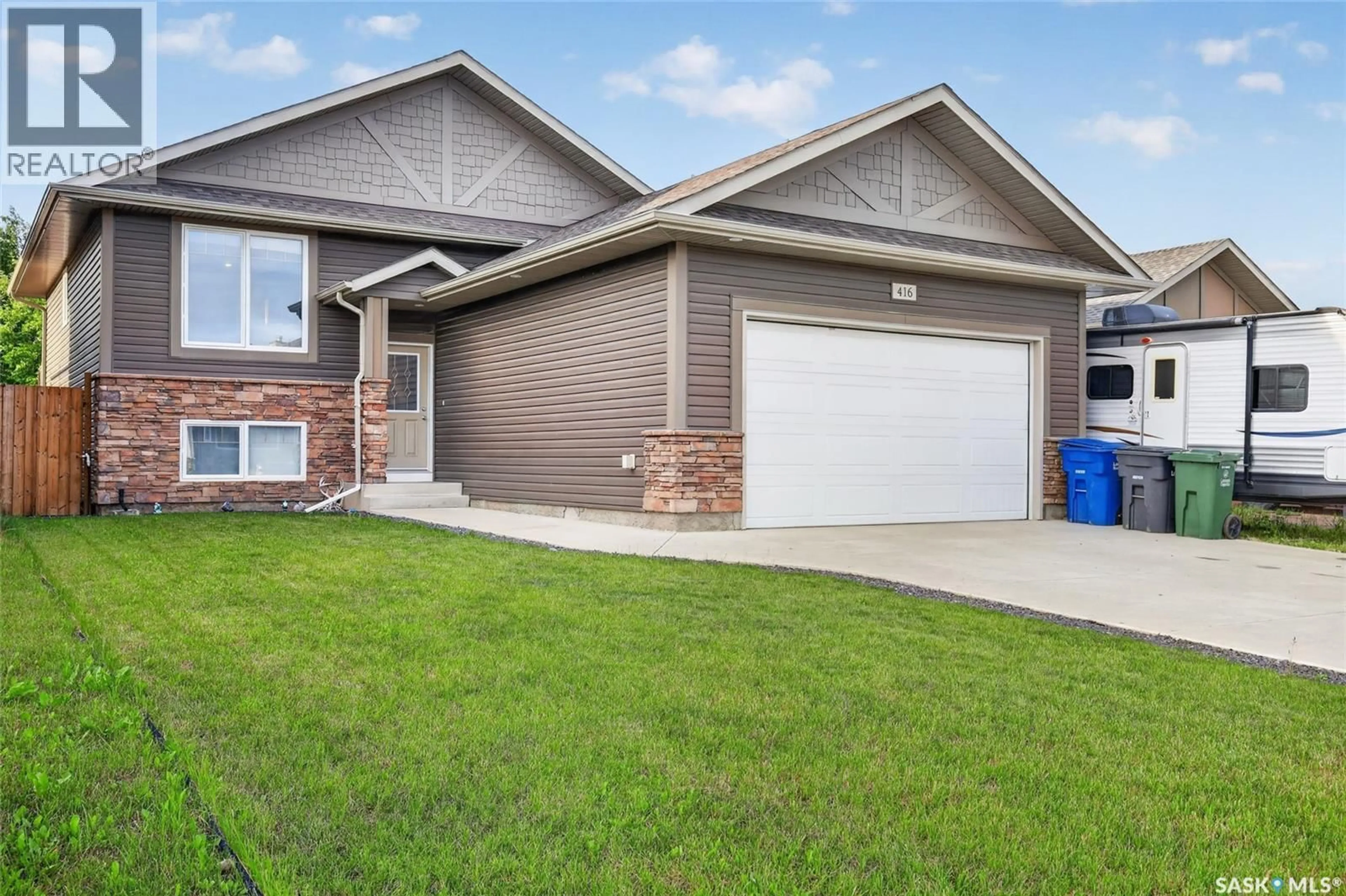 Home with vinyl exterior material, street for 416 LOEPPKY AVENUE, Dalmeny Saskatchewan S0K1E0