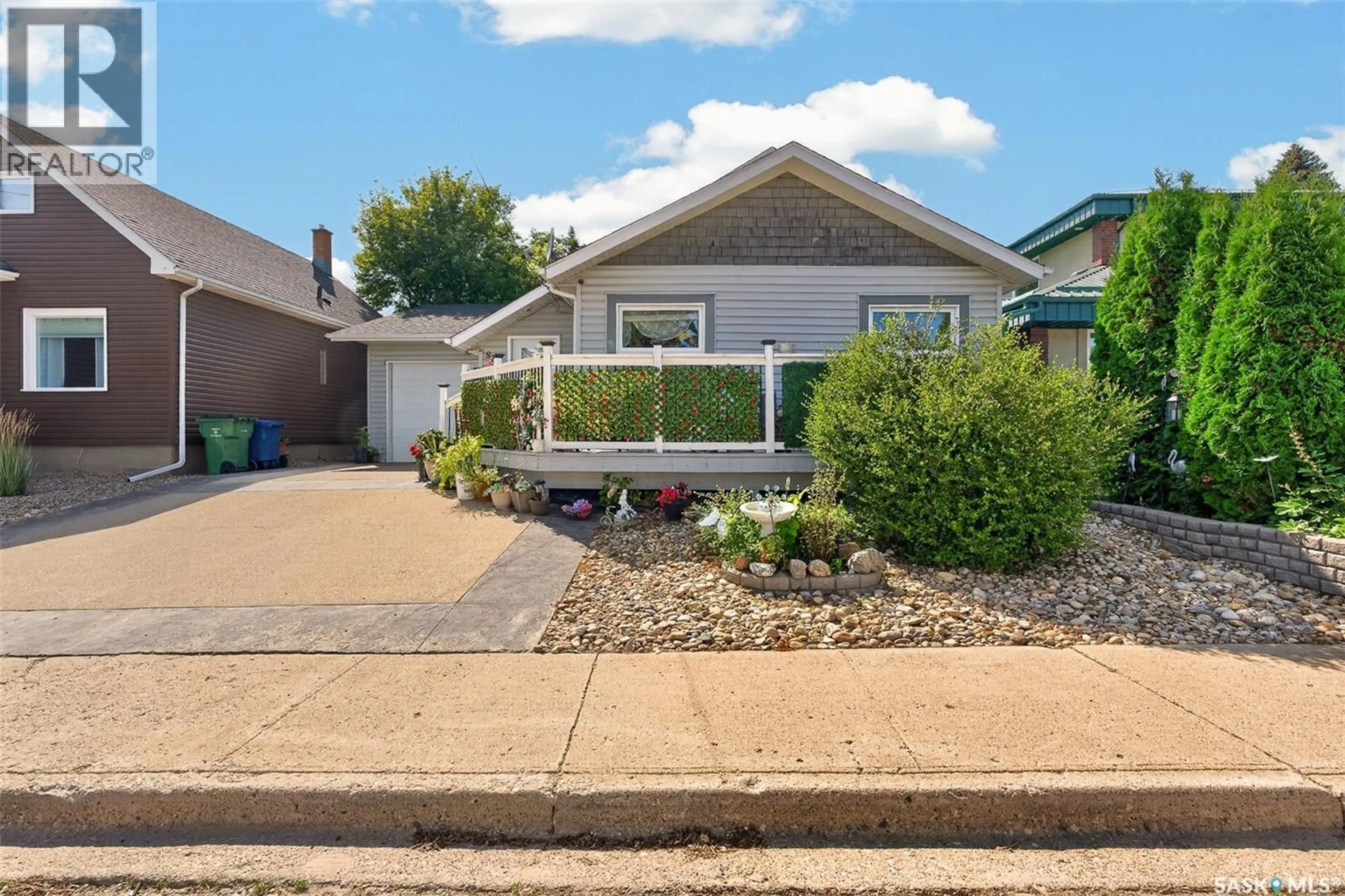 Home with vinyl exterior material, street for 892 ELGIN AVENUE, Moose Jaw Saskatchewan S6H4G7
