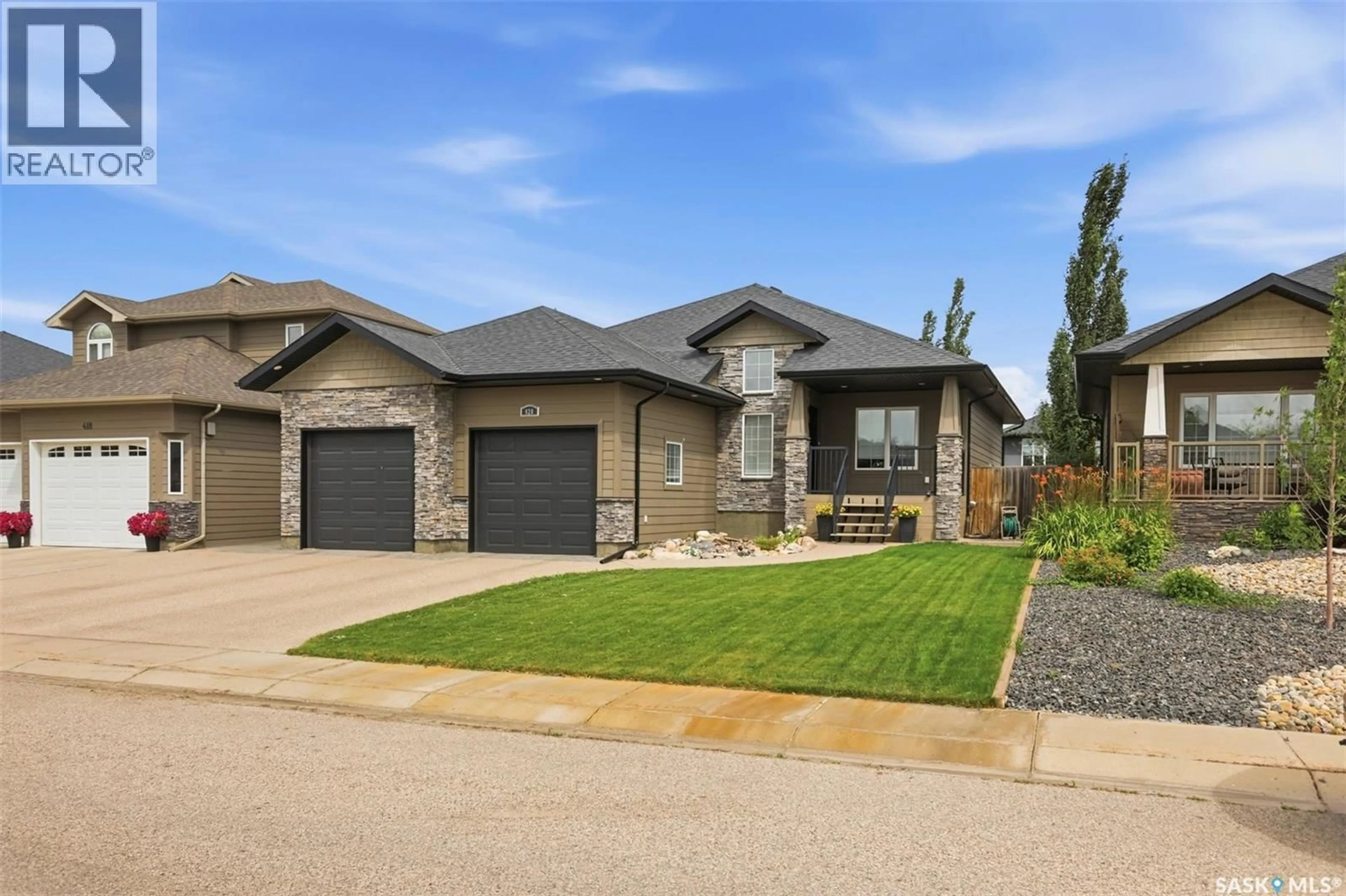 Home with brick exterior material, street for 420 HOGAN WAY, Warman Saskatchewan S0K0A1