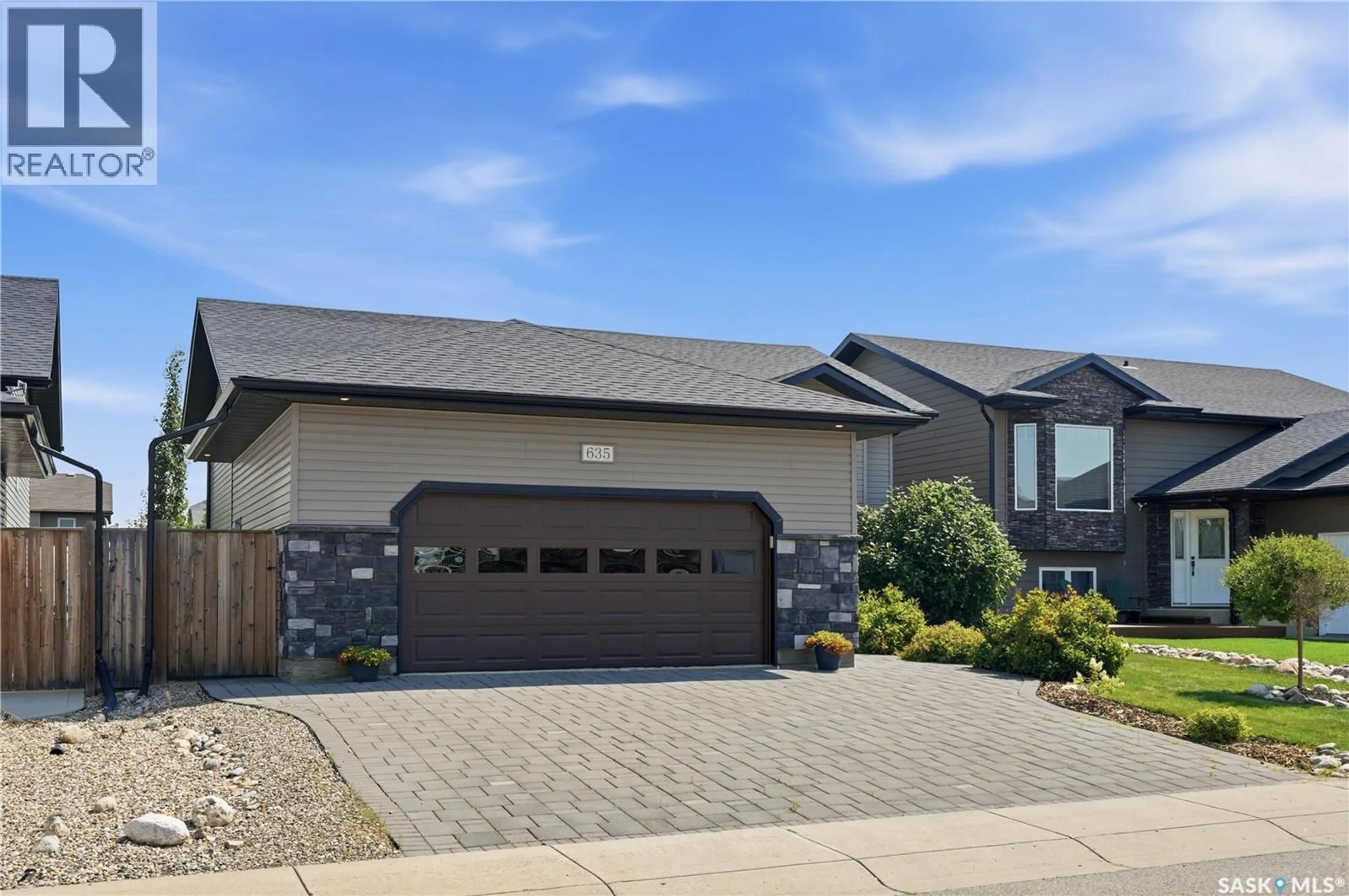 Home with brick exterior material, street for 635 REDWOOD CRESCENT, Warman Saskatchewan S0K4S2
