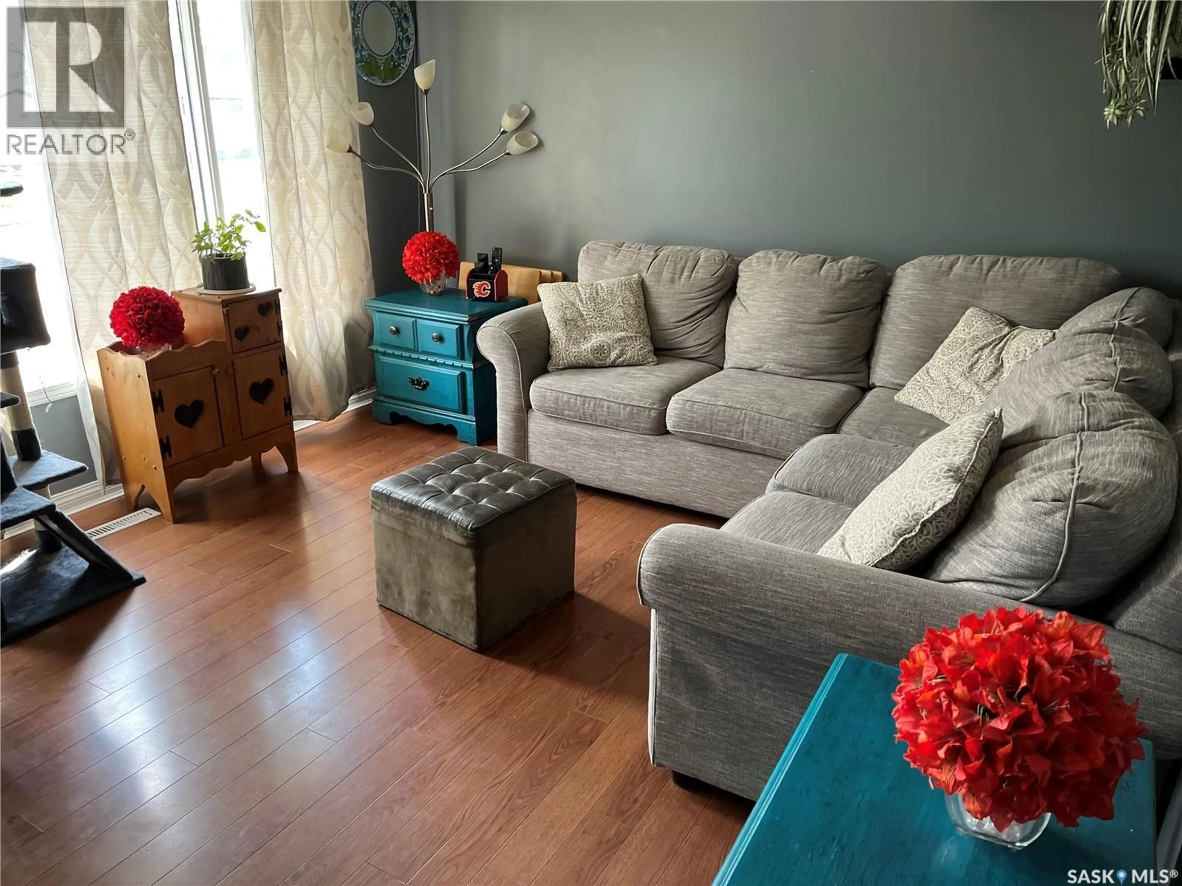 Living room with furniture, wood/laminate floor for 229 4TH AVENUE, Gravelbourg Saskatchewan S0H1X0
