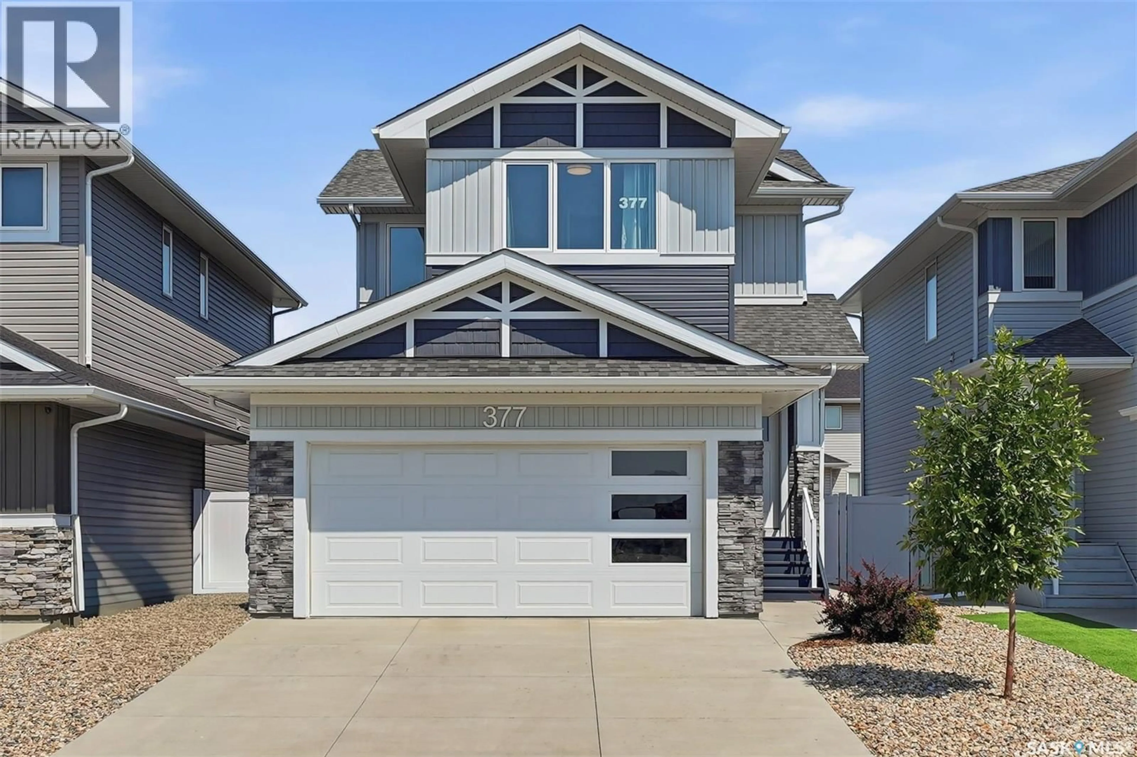 Home with vinyl exterior material, street for 377 GERMAIN MANOR, Saskatoon Saskatchewan S7V0V1