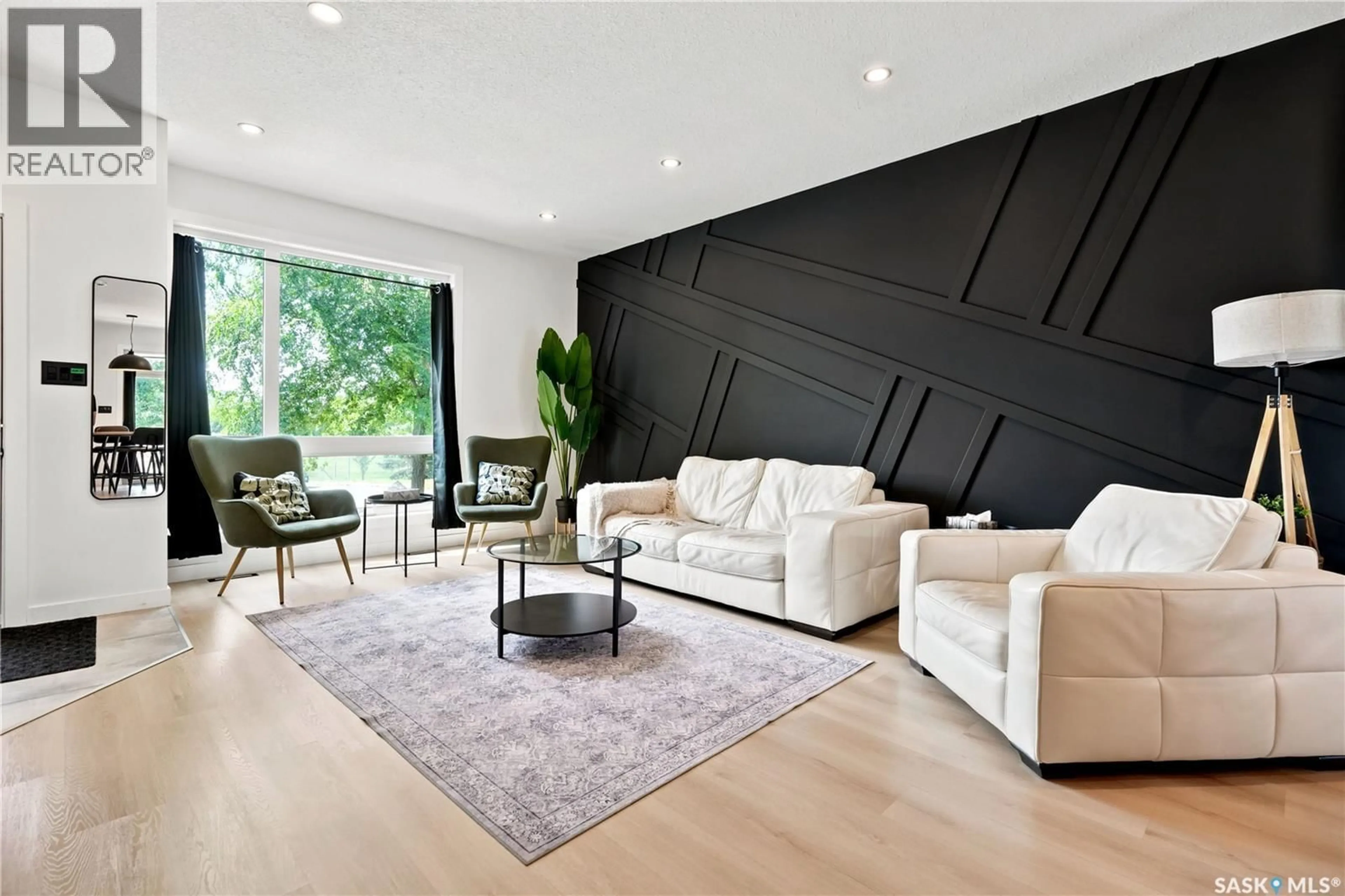 Living room with furniture, wood/laminate floor for 2023 EDWARD STREET, Regina Saskatchewan S4T4N3