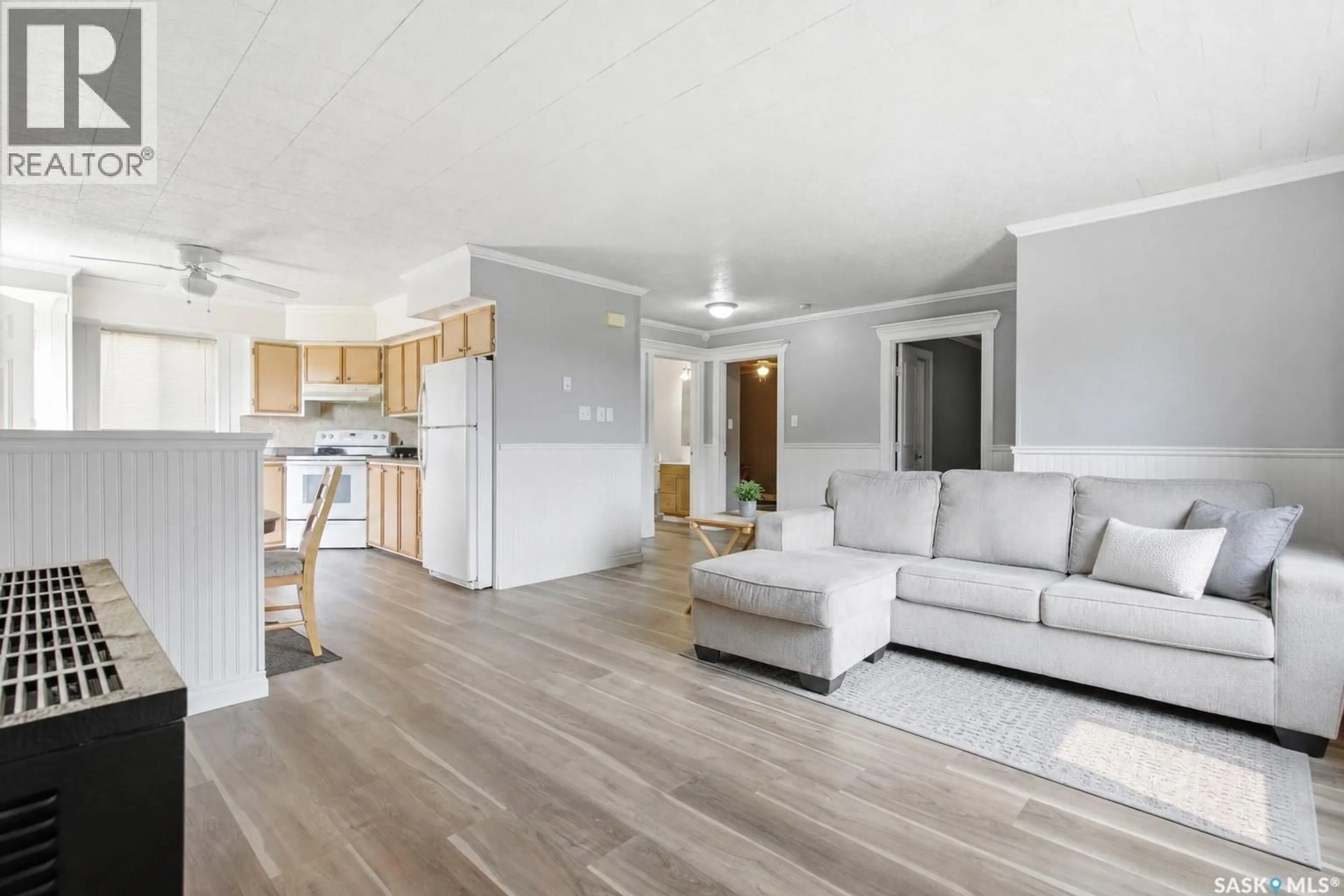 Living room with furniture, wood/laminate floor for 157 4TH STREET, Pierceland Saskatchewan S0M2K0