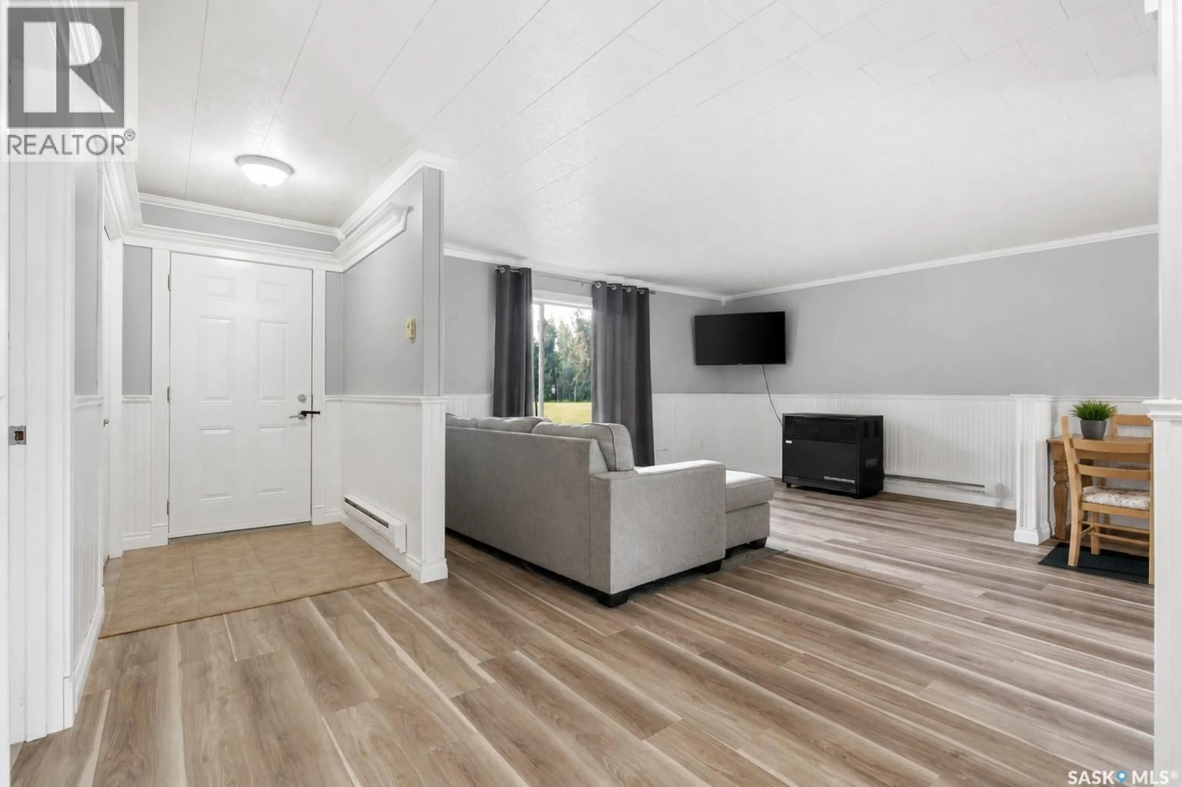 Living room with furniture, wood/laminate floor for 157 4TH STREET, Pierceland Saskatchewan S0M2K0