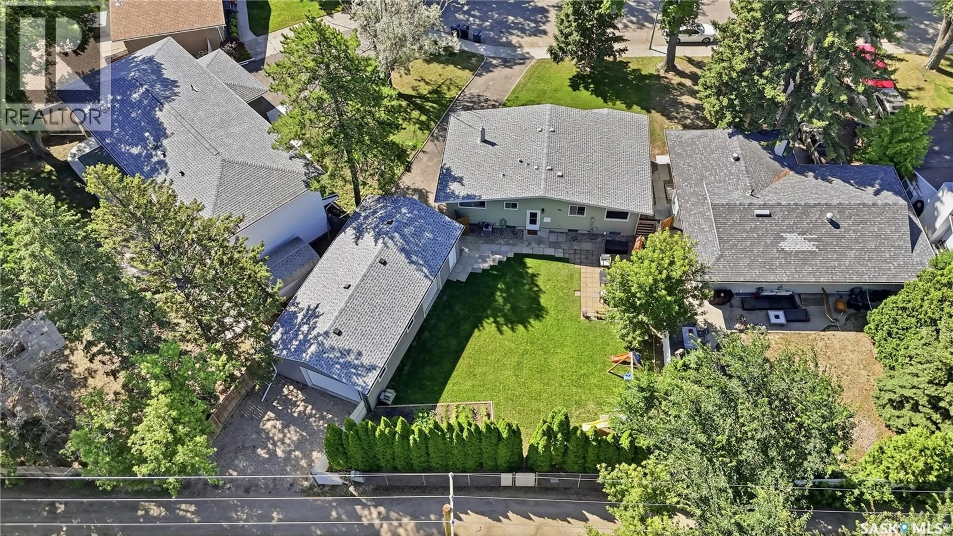 A pic from outside/outdoor area/front of a property/back of a property/a pic from drone, street for 57 POTTER CRESCENT, Saskatoon Saskatchewan S7H3L2