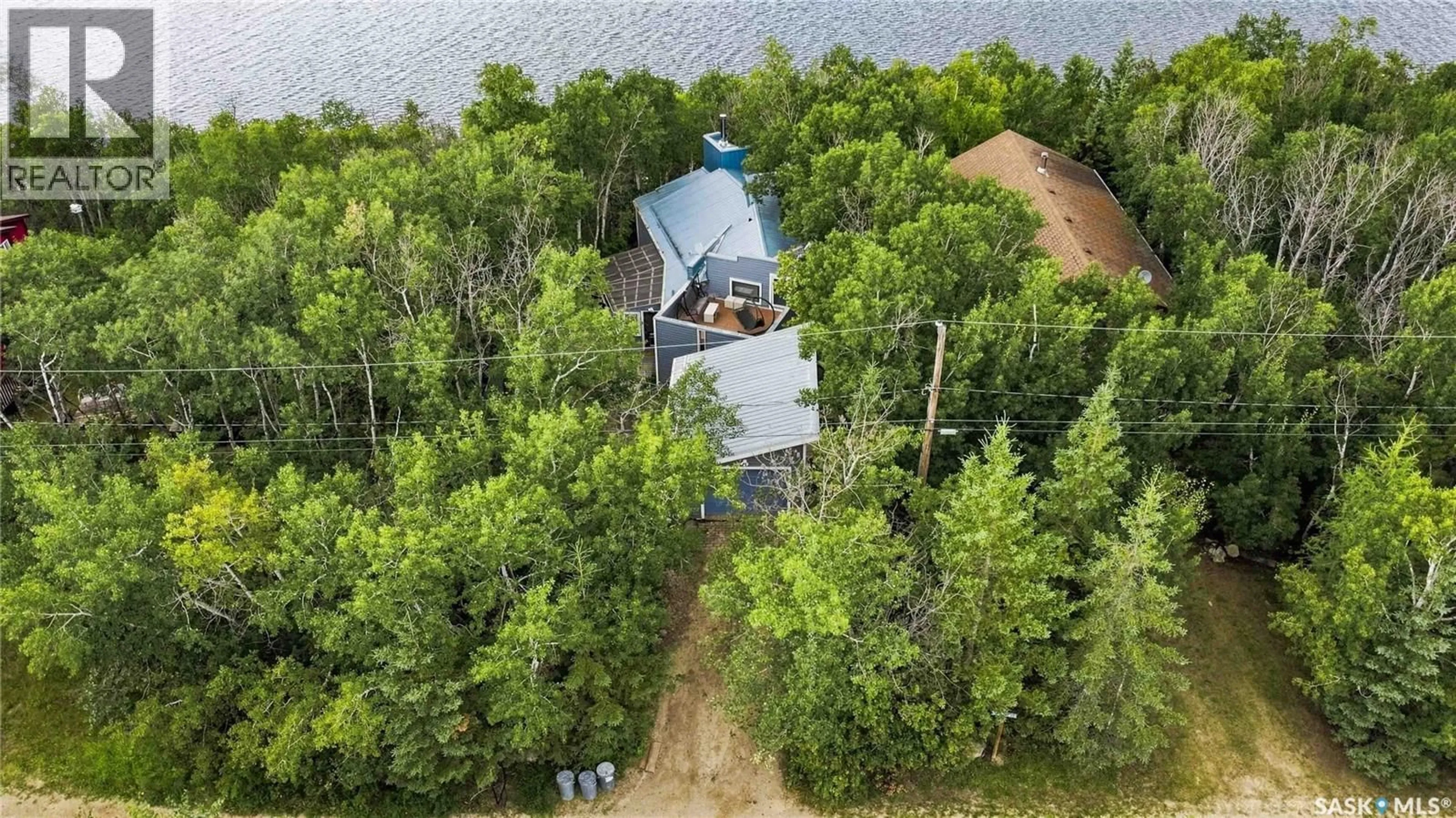 A pic from outside/outdoor area/front of a property/back of a property/a pic from drone, water/lake/river/ocean view for 3409 NICKORICK BEACH, Wakaw Lake Saskatchewan S0K4P0