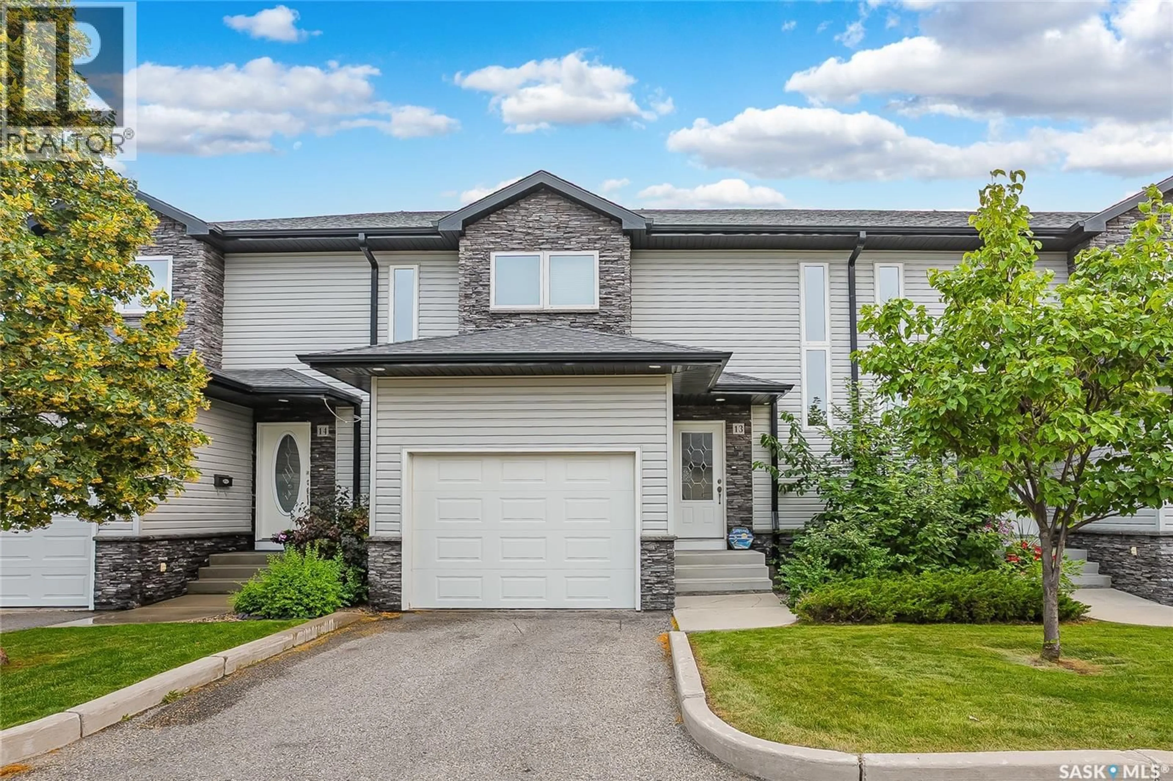 Home with vinyl exterior material, street for 13 547 EAST HAMPTON BOULEVARD, Saskatoon Saskatchewan S7R0H8