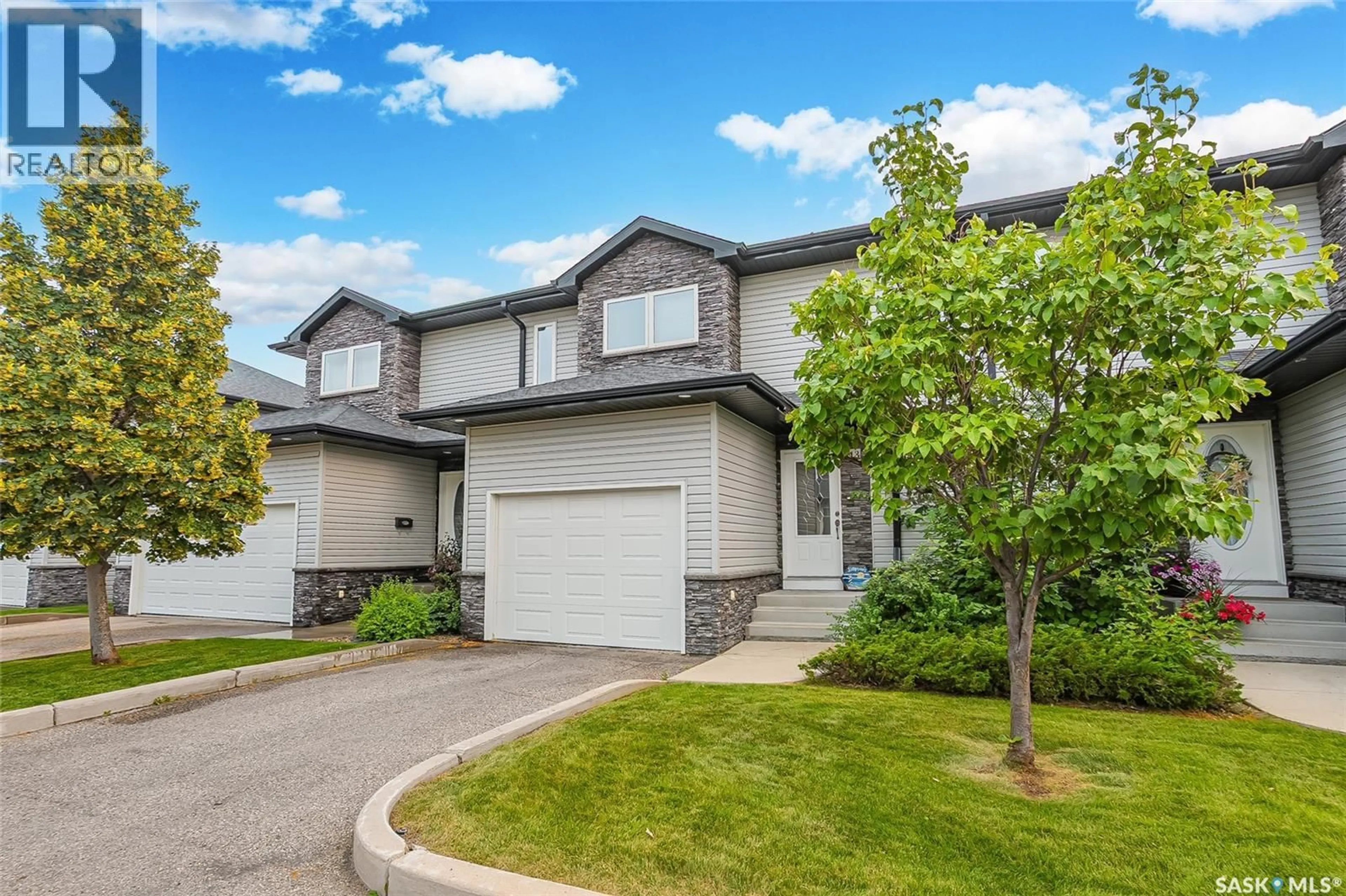 Home with vinyl exterior material, street for 13 547 EAST HAMPTON BOULEVARD, Saskatoon Saskatchewan S7R0H8