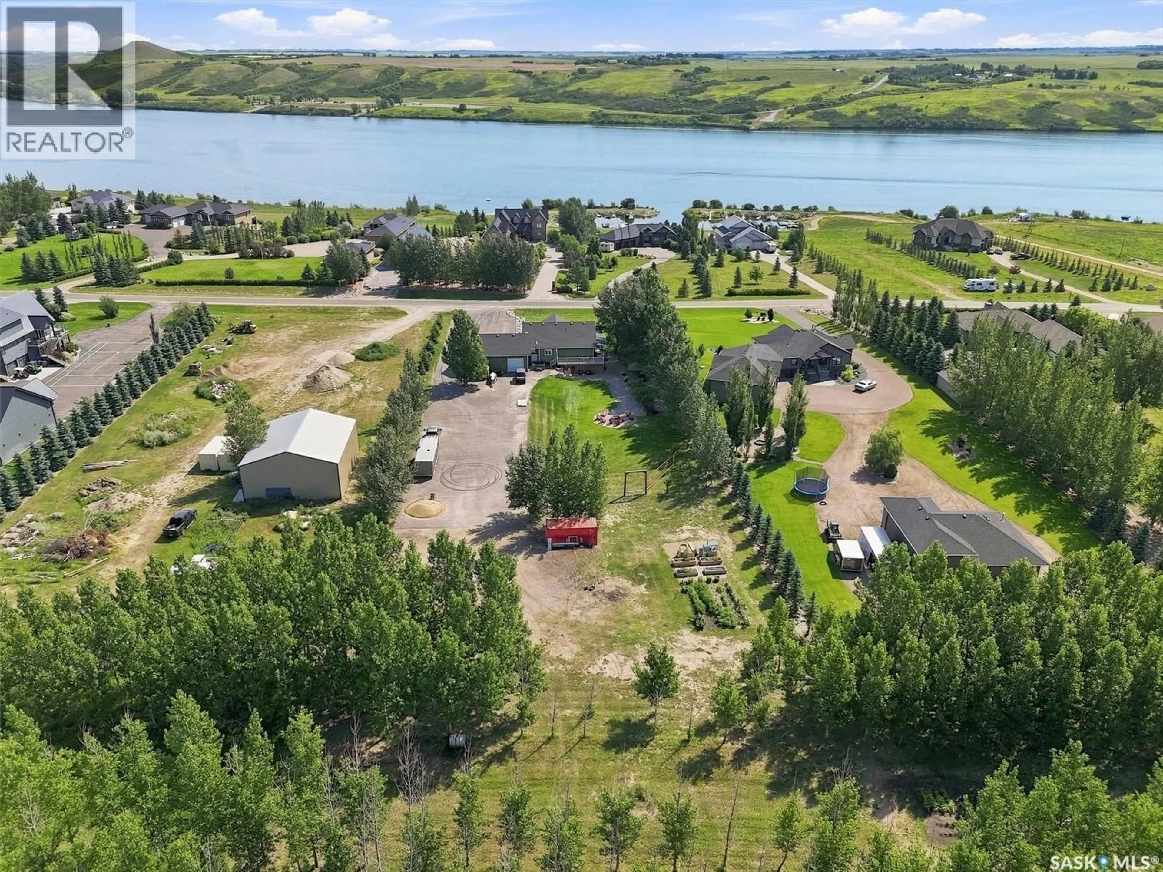 A pic from outside/outdoor area/front of a property/back of a property/a pic from drone, water/lake/river/ocean view for 8 SUNRISE DRIVE, Blackstrap Reservoir Saskatchewan S0K1K0