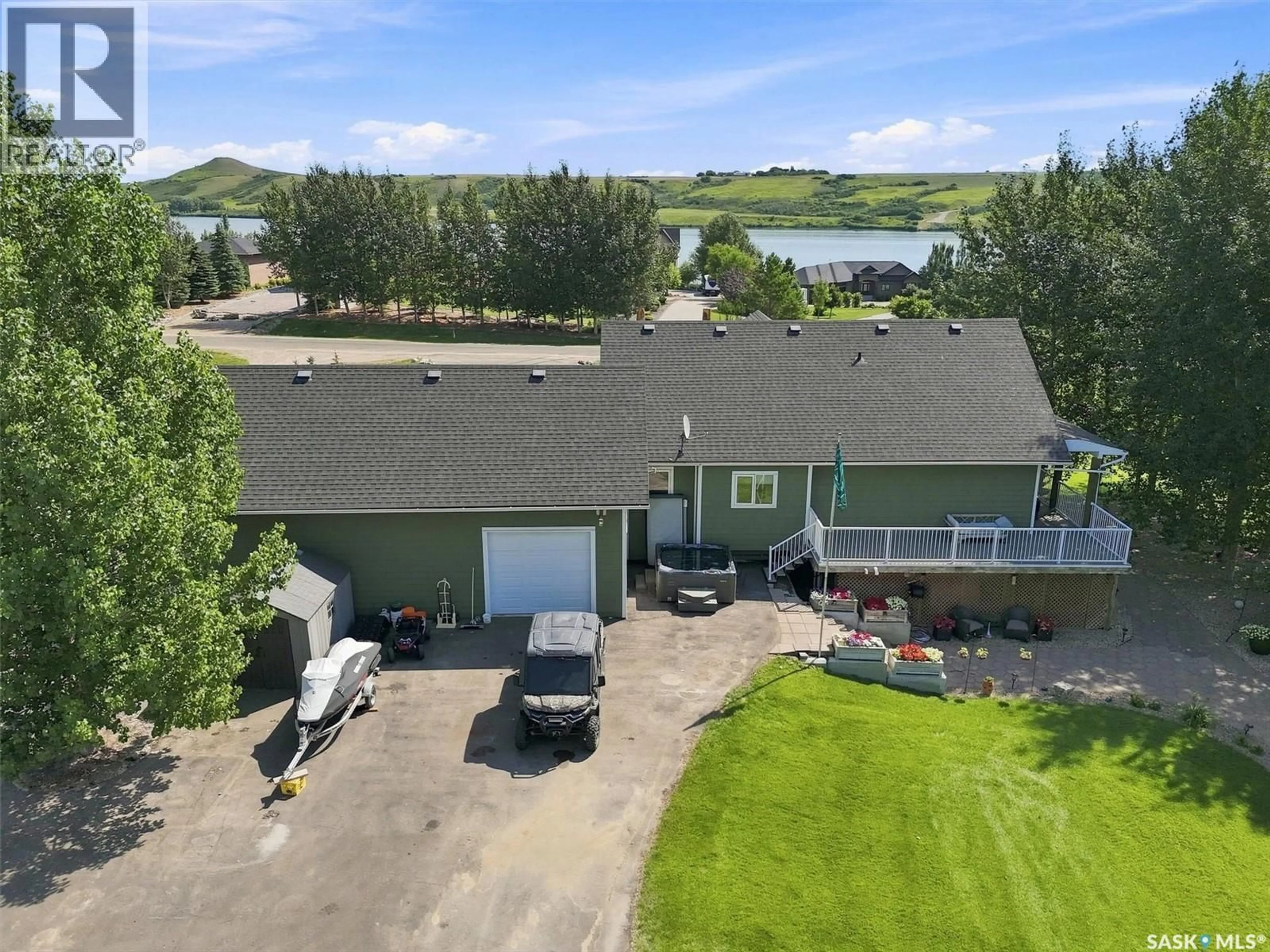 A pic from outside/outdoor area/front of a property/back of a property/a pic from drone, water/lake/river/ocean view for 8 SUNRISE DRIVE, Blackstrap Reservoir Saskatchewan S0K1K0