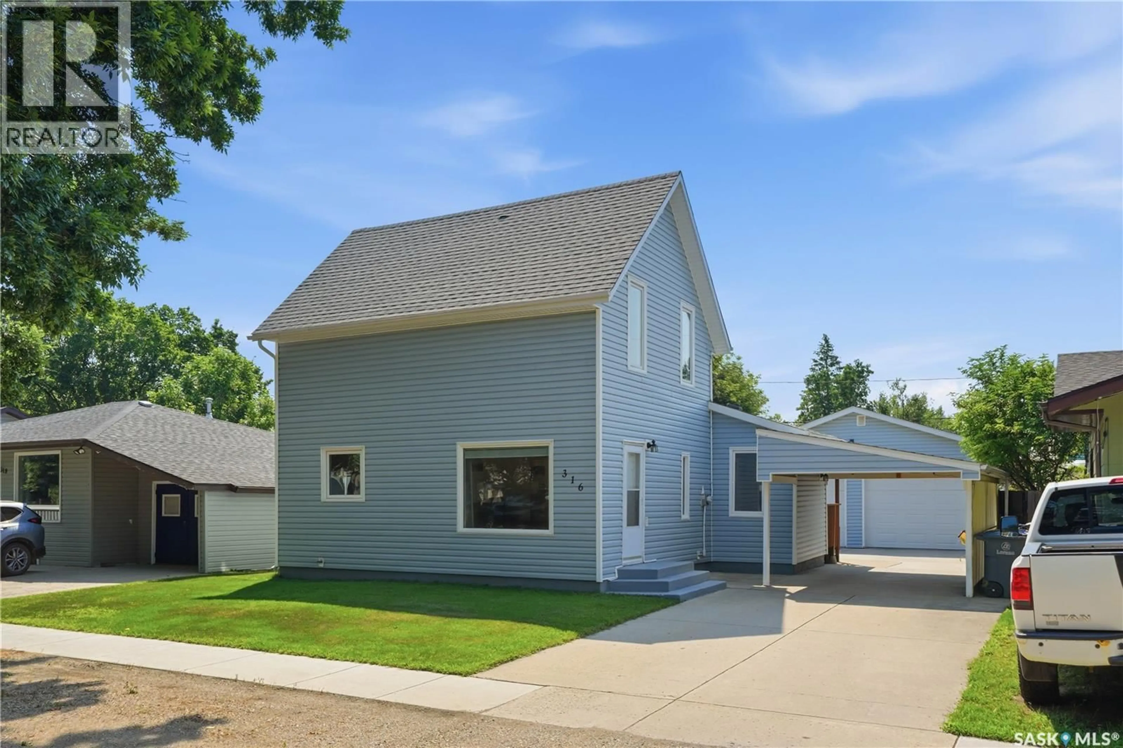 Home with vinyl exterior material, street for 316 1ST STREET, Langham Saskatchewan S0K2L0