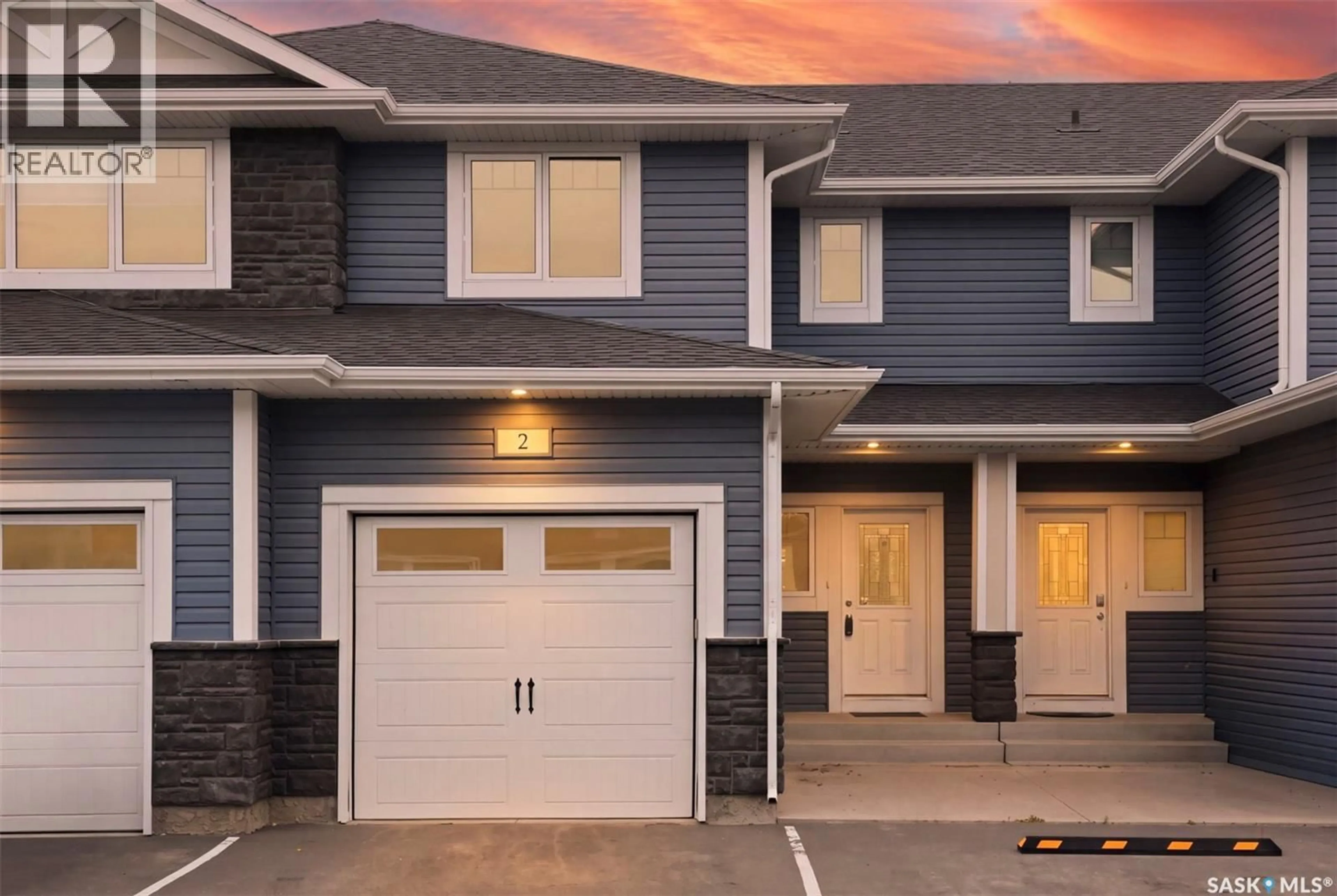 Home with vinyl exterior material, street for 2 115 VELTKAMP CRESCENT, Saskatoon Saskatchewan S7T0T7