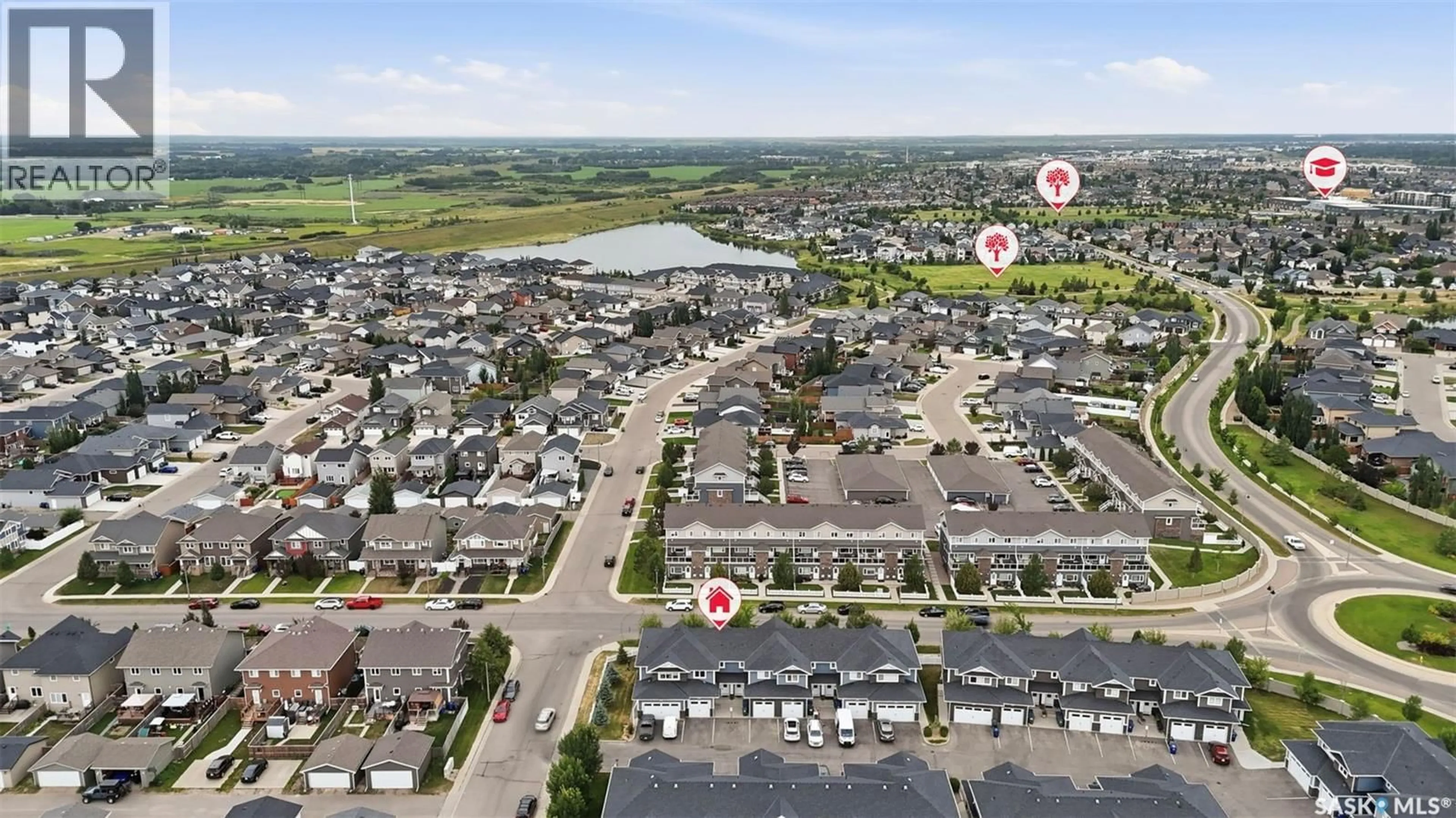 A pic from outside/outdoor area/front of a property/back of a property/a pic from drone, water/lake/river/ocean view for 2 115 VELTKAMP CRESCENT, Saskatoon Saskatchewan S7T0T7