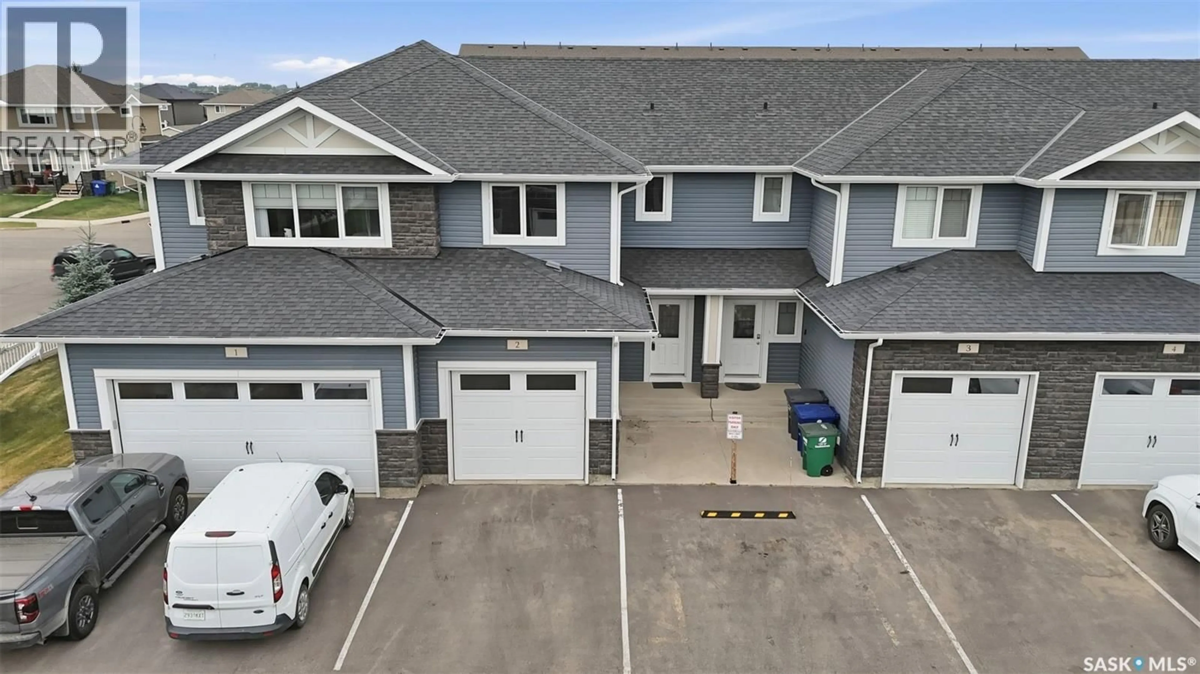 A pic from outside/outdoor area/front of a property/back of a property/a pic from drone, unknown for 2 115 VELTKAMP CRESCENT, Saskatoon Saskatchewan S7T0T7