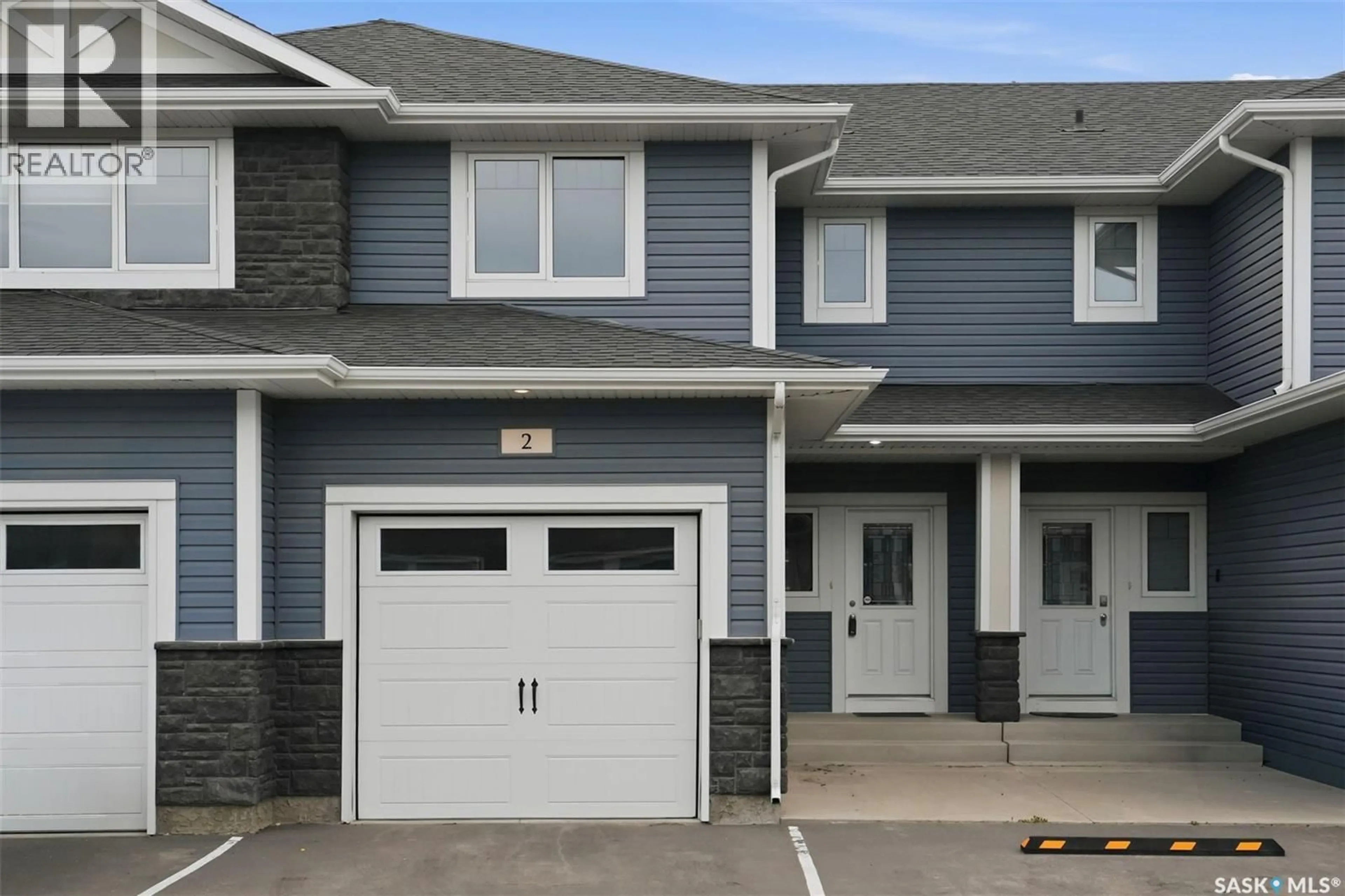Home with vinyl exterior material, street for 2 115 VELTKAMP CRESCENT, Saskatoon Saskatchewan S7T0T7