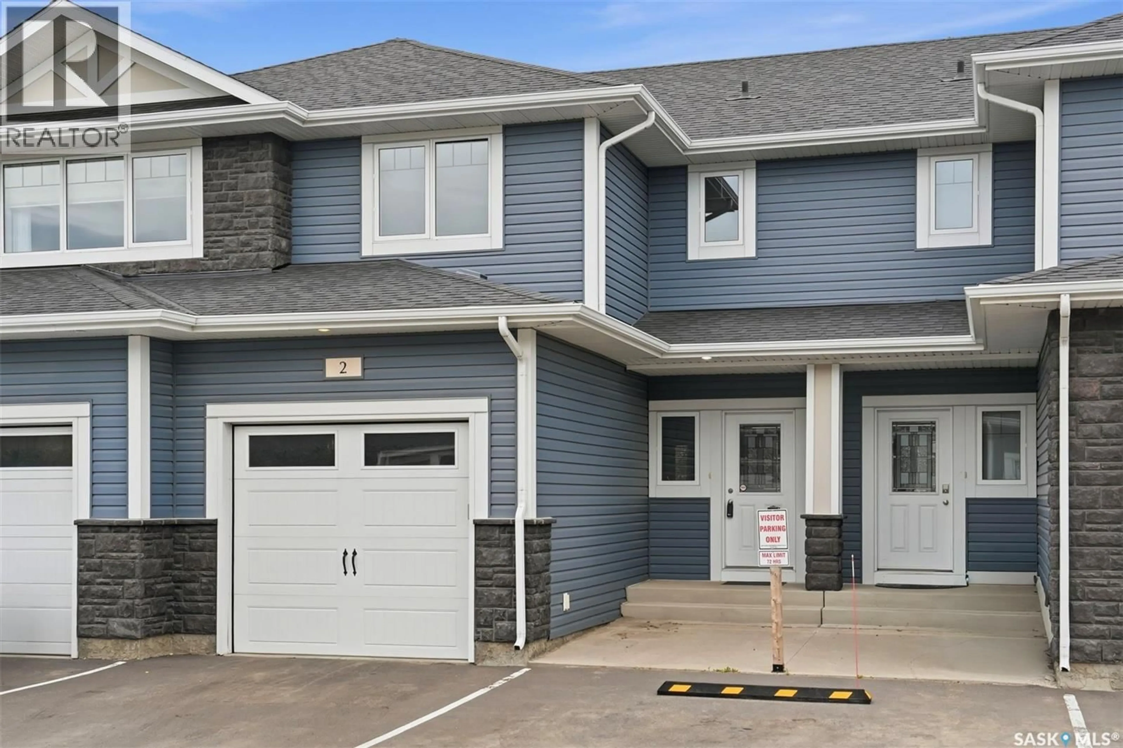Home with vinyl exterior material, street for 2 115 VELTKAMP CRESCENT, Saskatoon Saskatchewan S7T0T7