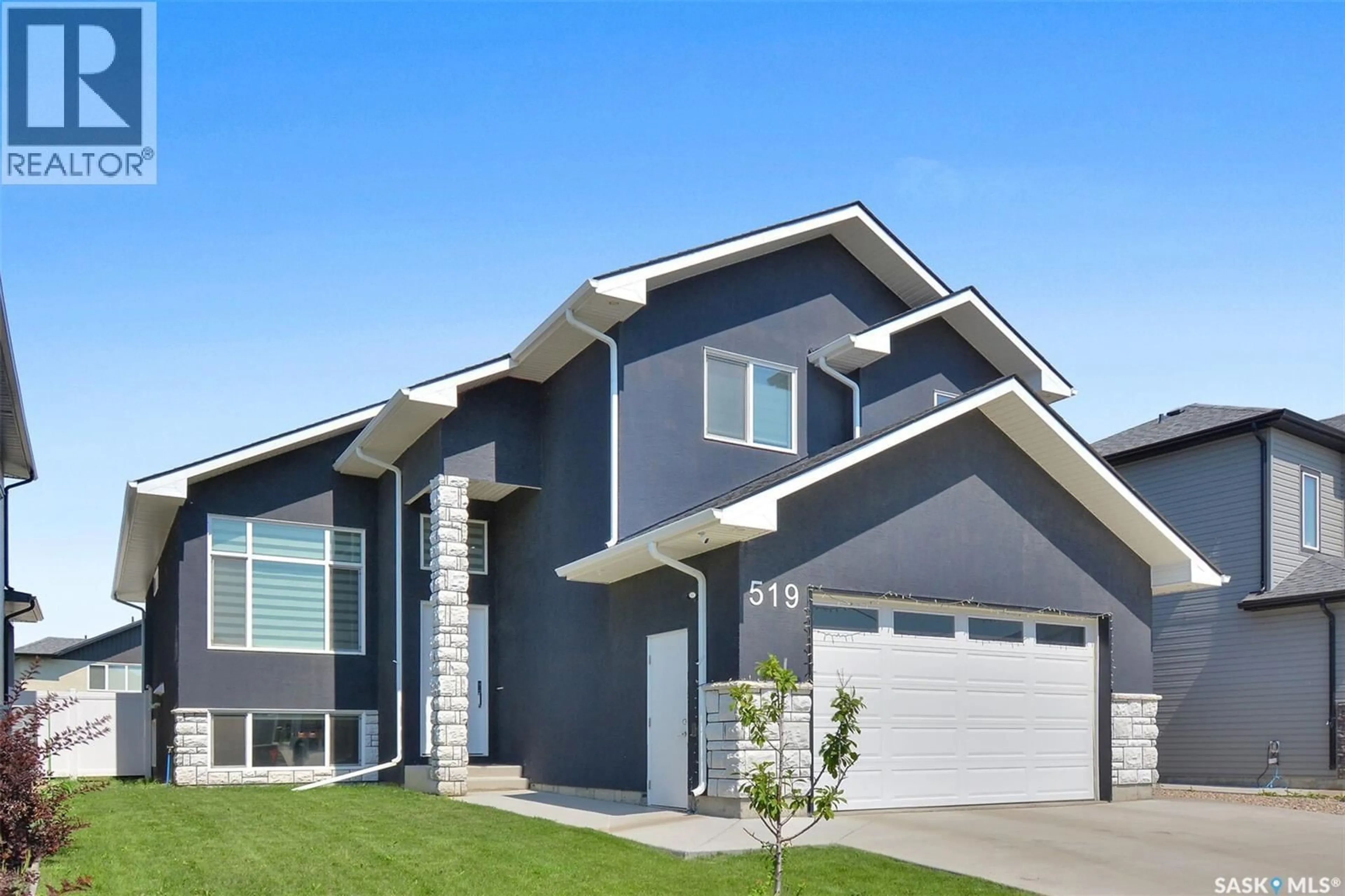 Home with vinyl exterior material, street for 519 KENASCHUK WAY, Saskatoon Saskatchewan S7W0Y5