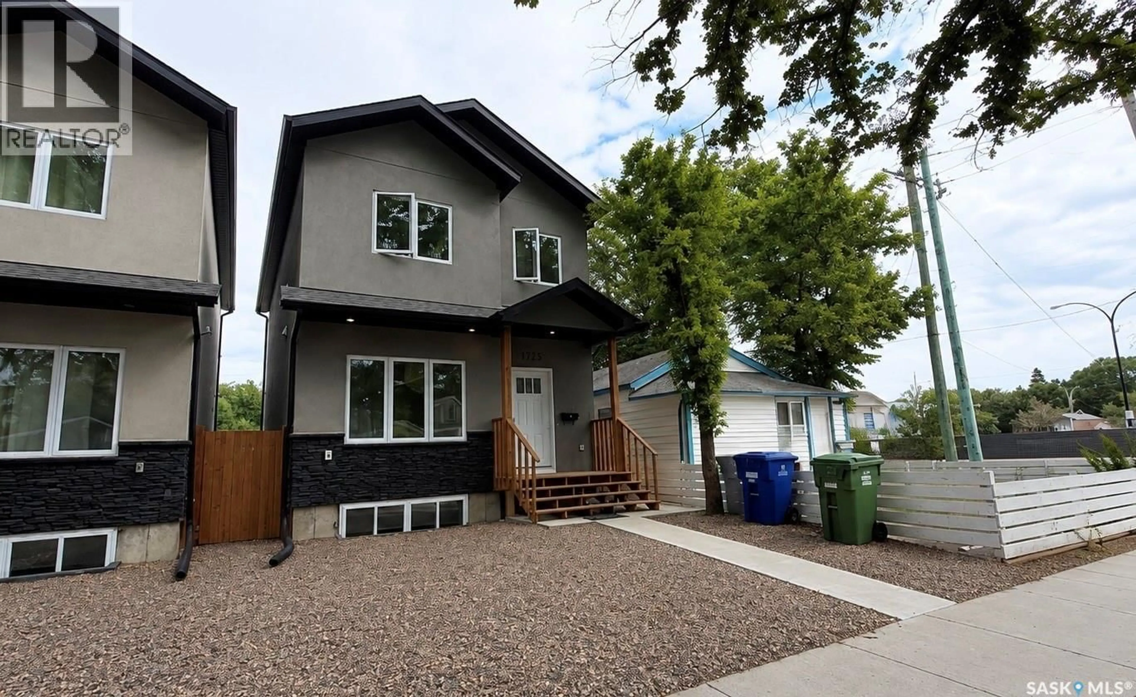 Home with vinyl exterior material, street for 1220 D AVENUE, Saskatoon Saskatchewan S7L1P1