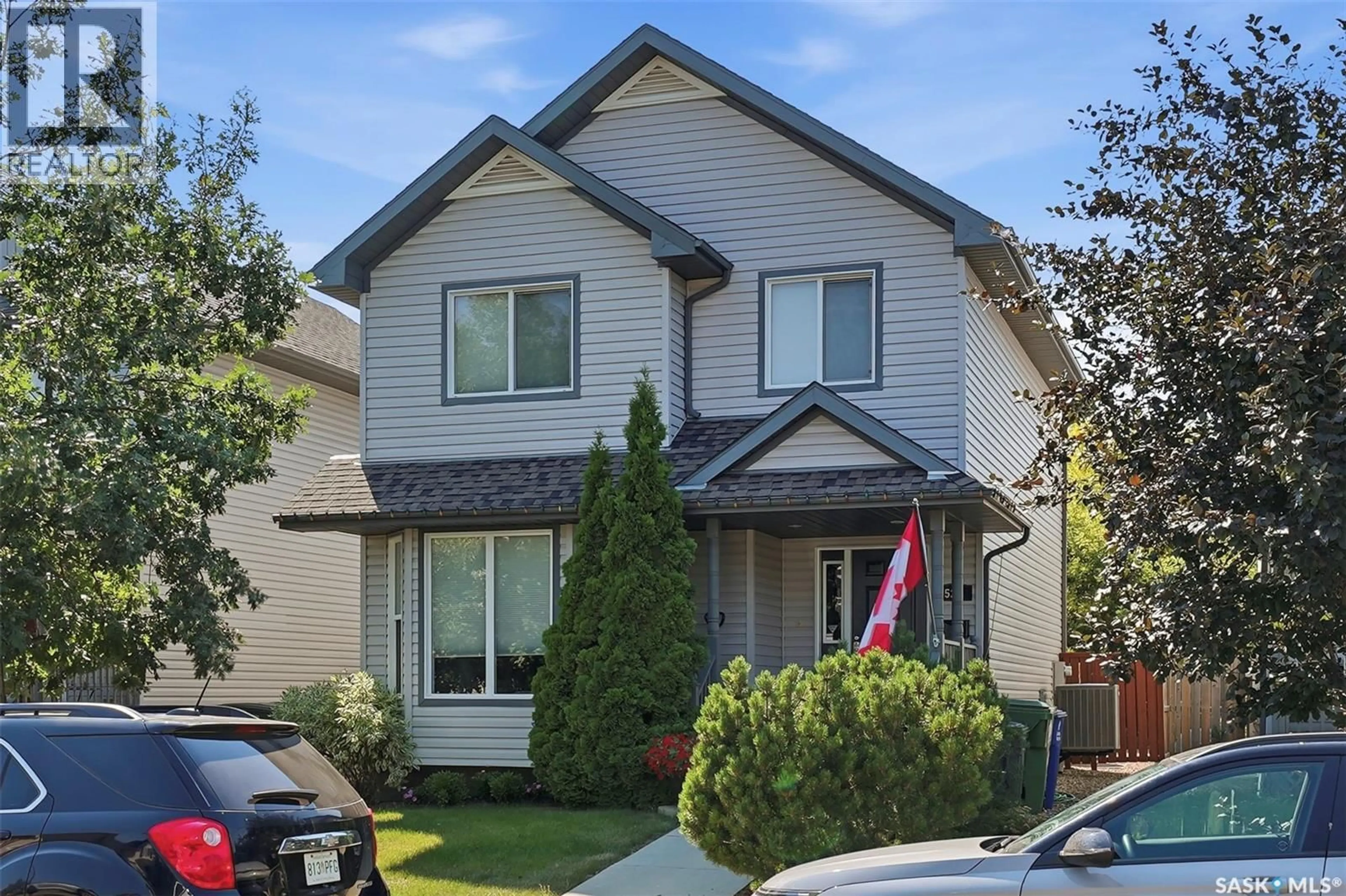 Home with vinyl exterior material, street for 523 DENHAM WAY, Saskatoon Saskatchewan S7R1E5