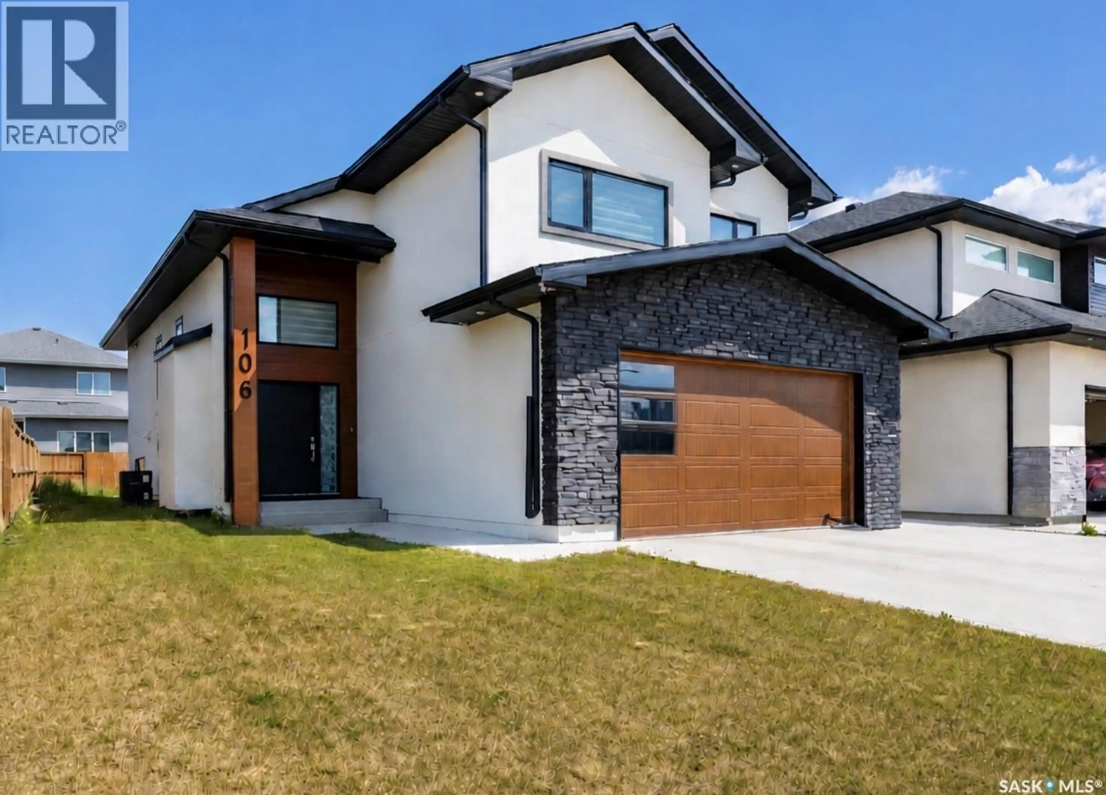 Home with brick exterior material, street for 106 KENASCHUK CRESCENT, Saskatoon Saskatchewan S7W0Y6