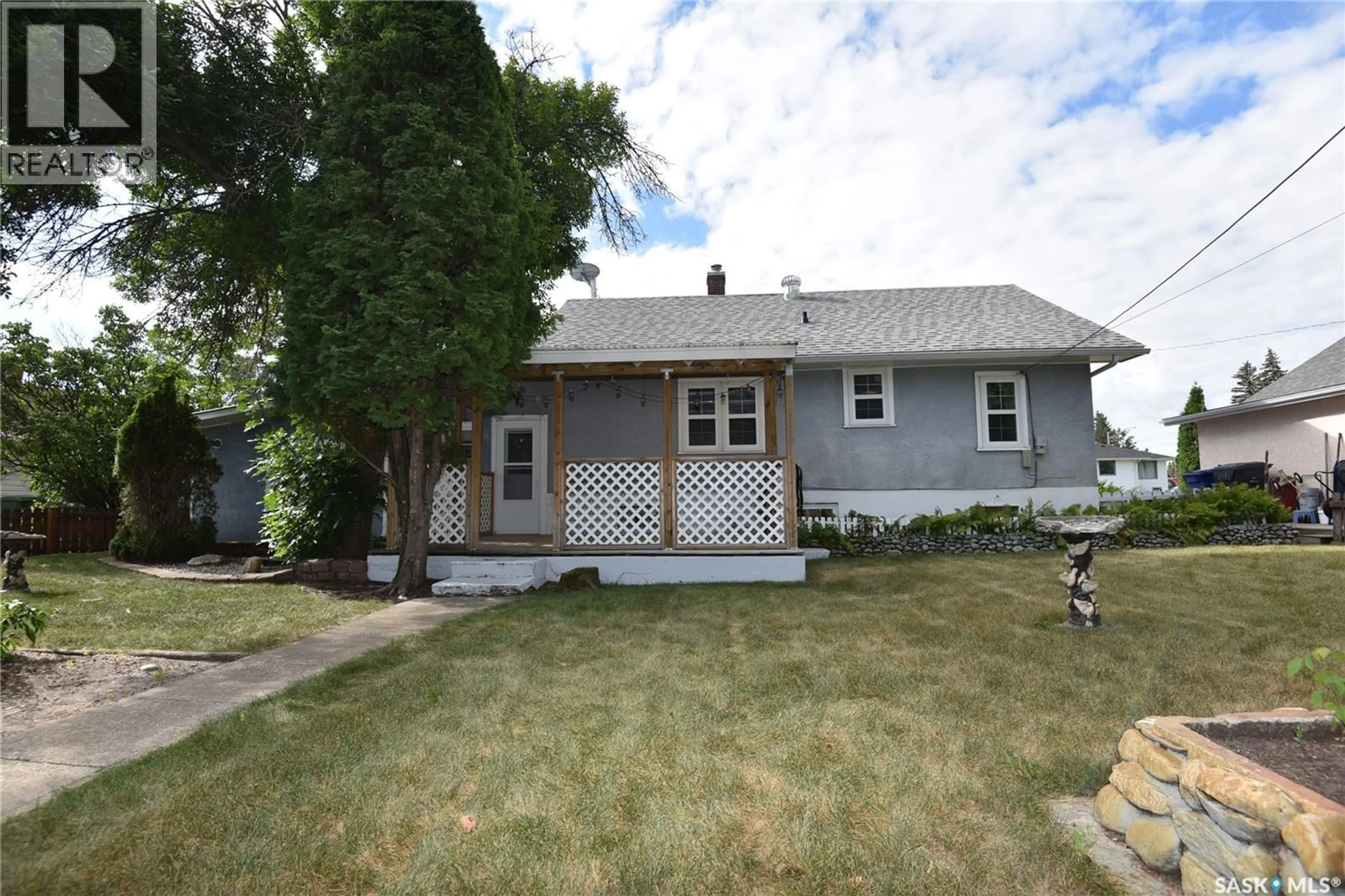 Home with vinyl exterior material, street for 207 PINE AVENUE, Nipawin Saskatchewan S0E1E0