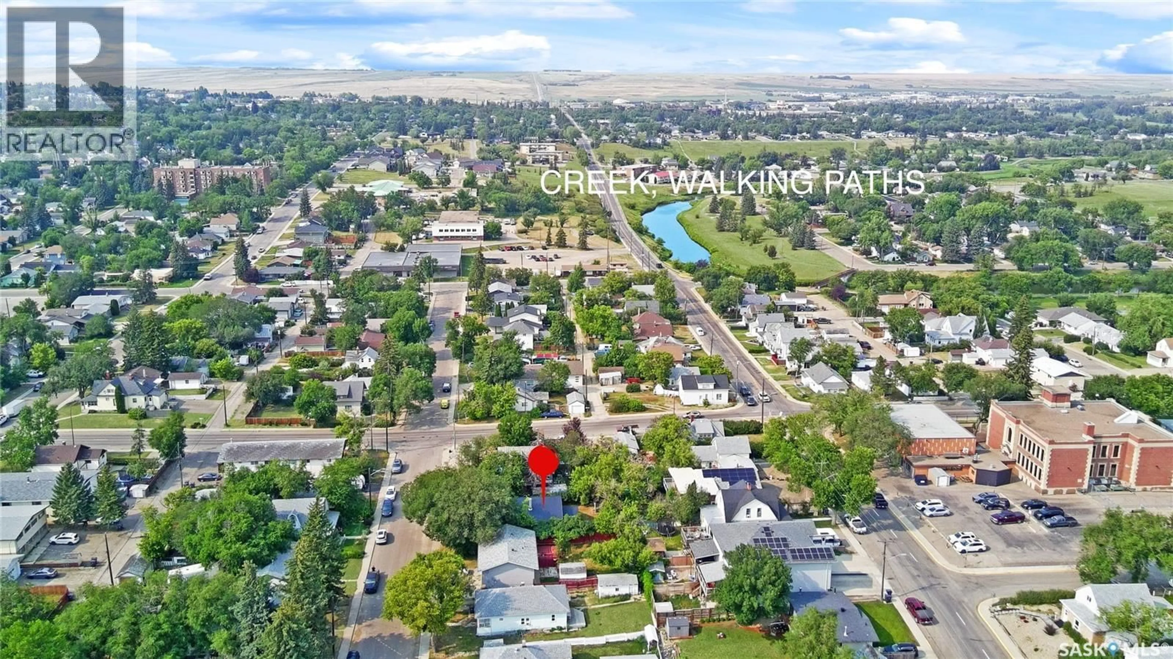 A pic from outside/outdoor area/front of a property/back of a property/a pic from drone, street for 161 5TH AVENUE NE, Swift Current Saskatchewan S9H2L1