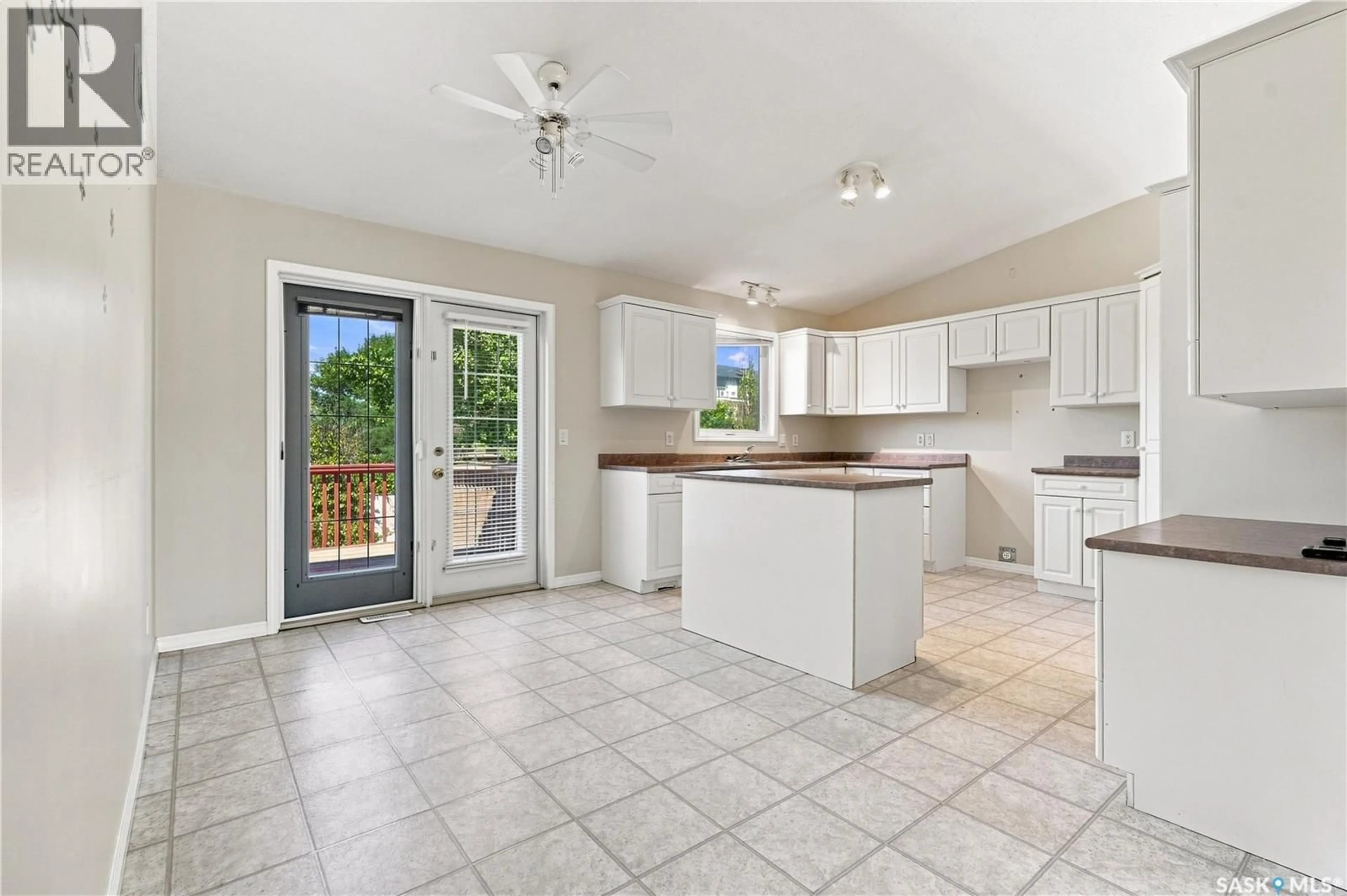 Open concept kitchen, ceramic/tile floor for 210 BEERLING CRESCENT, Saskatoon Saskatchewan S7S1K4