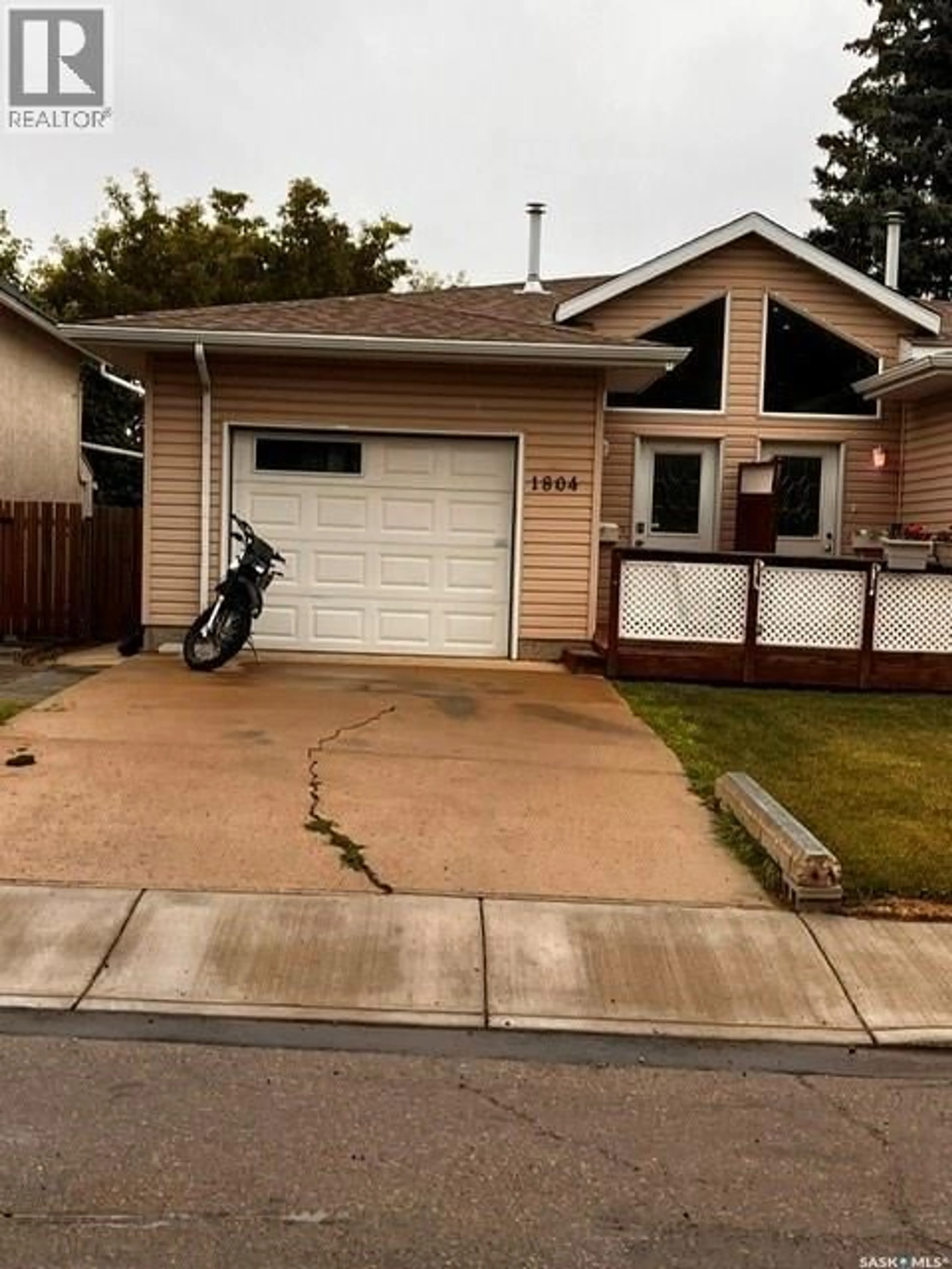 Home with vinyl exterior material, street for 1804 BELFAST AVENUE, Saskatoon Saskatchewan S7M0L8