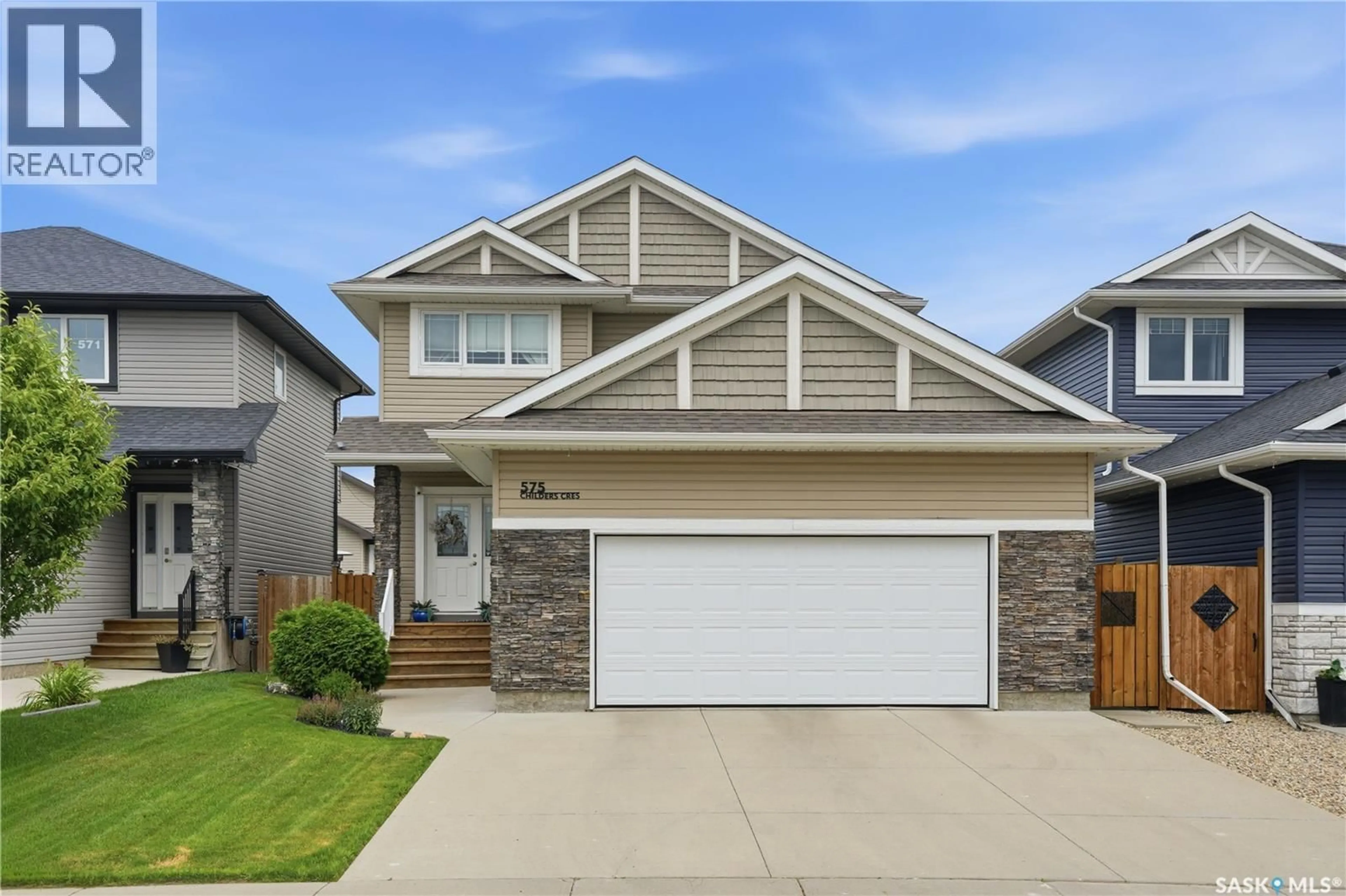 Home with vinyl exterior material, street for 575 CHILDERS CRESCENT, Saskatoon Saskatchewan S7L4P7