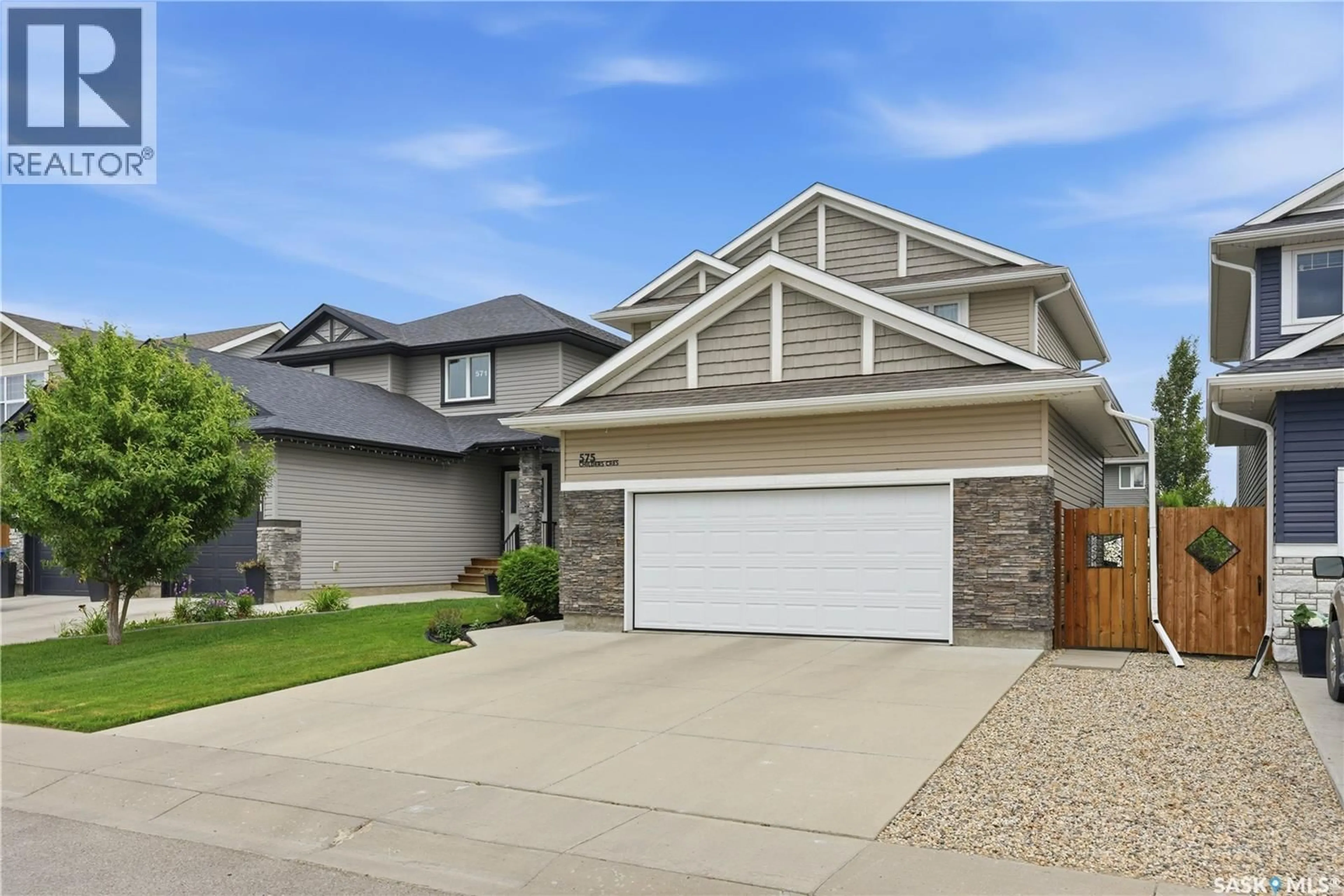 Home with vinyl exterior material, street for 575 CHILDERS CRESCENT, Saskatoon Saskatchewan S7L4P7