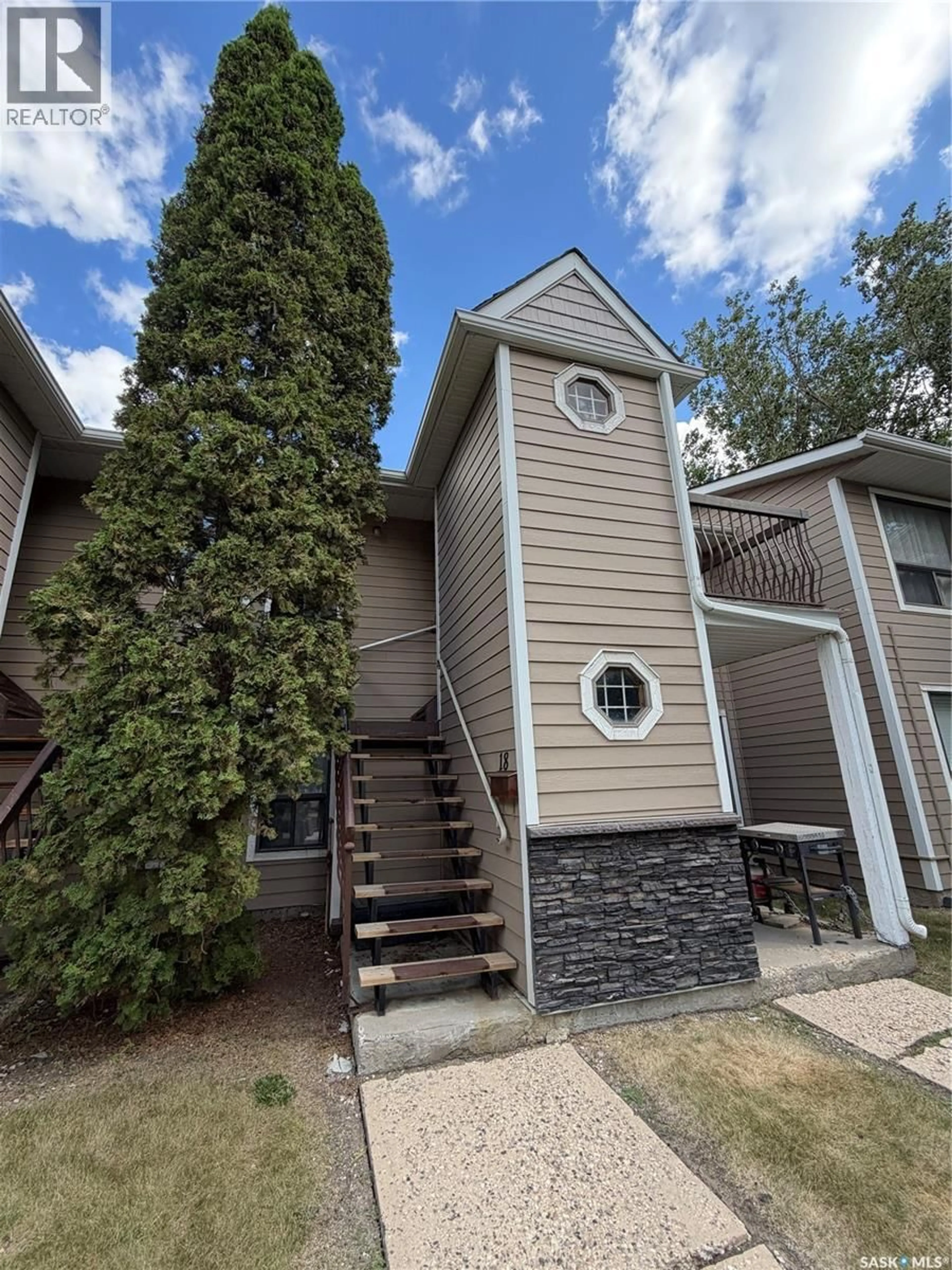 Home with vinyl exterior material, street for 18 CEDAR MEADOW DRIVE, Regina Saskatchewan S4X3J6