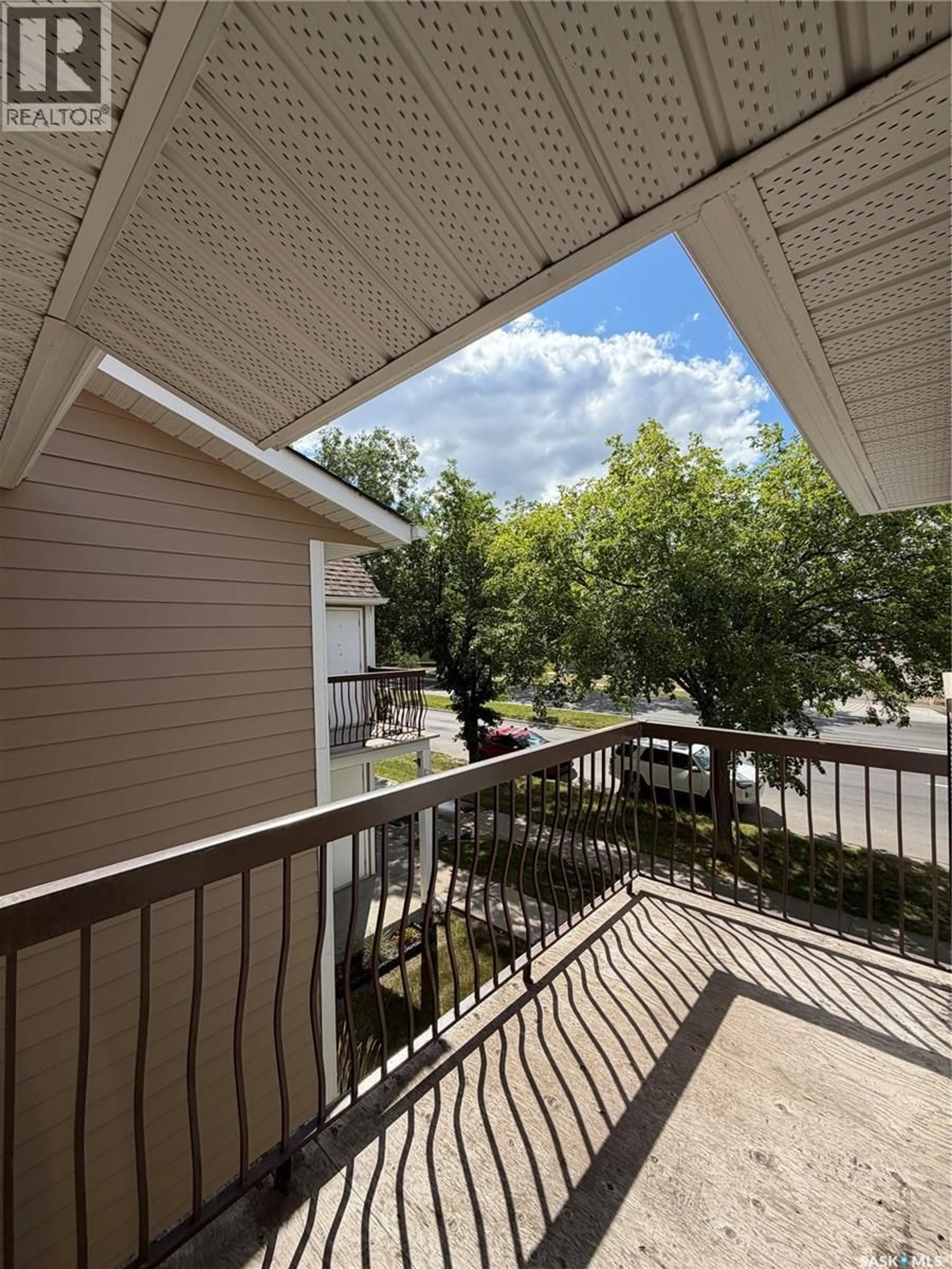 Patio, city buildings view from balcony for 18 CEDAR MEADOW DRIVE, Regina Saskatchewan S4X3J6
