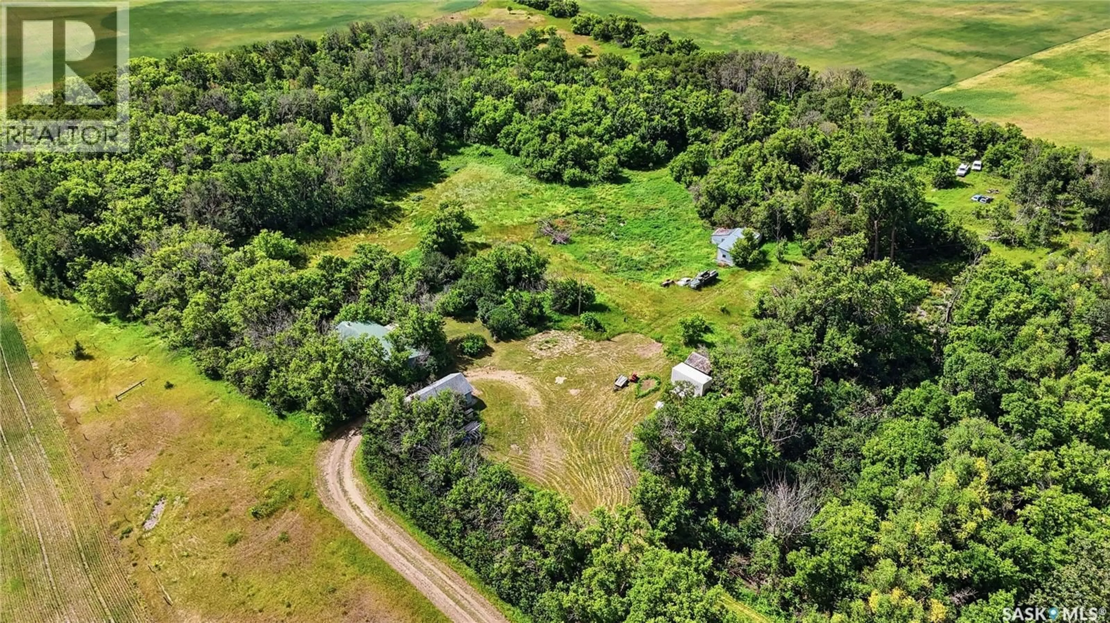 A pic from outside/outdoor area/front of a property/back of a property/a pic from drone, forest/trees view for GREAT BEND ACREAGE, Great Bend Rm No. 405 Saskatchewan S0K0N0