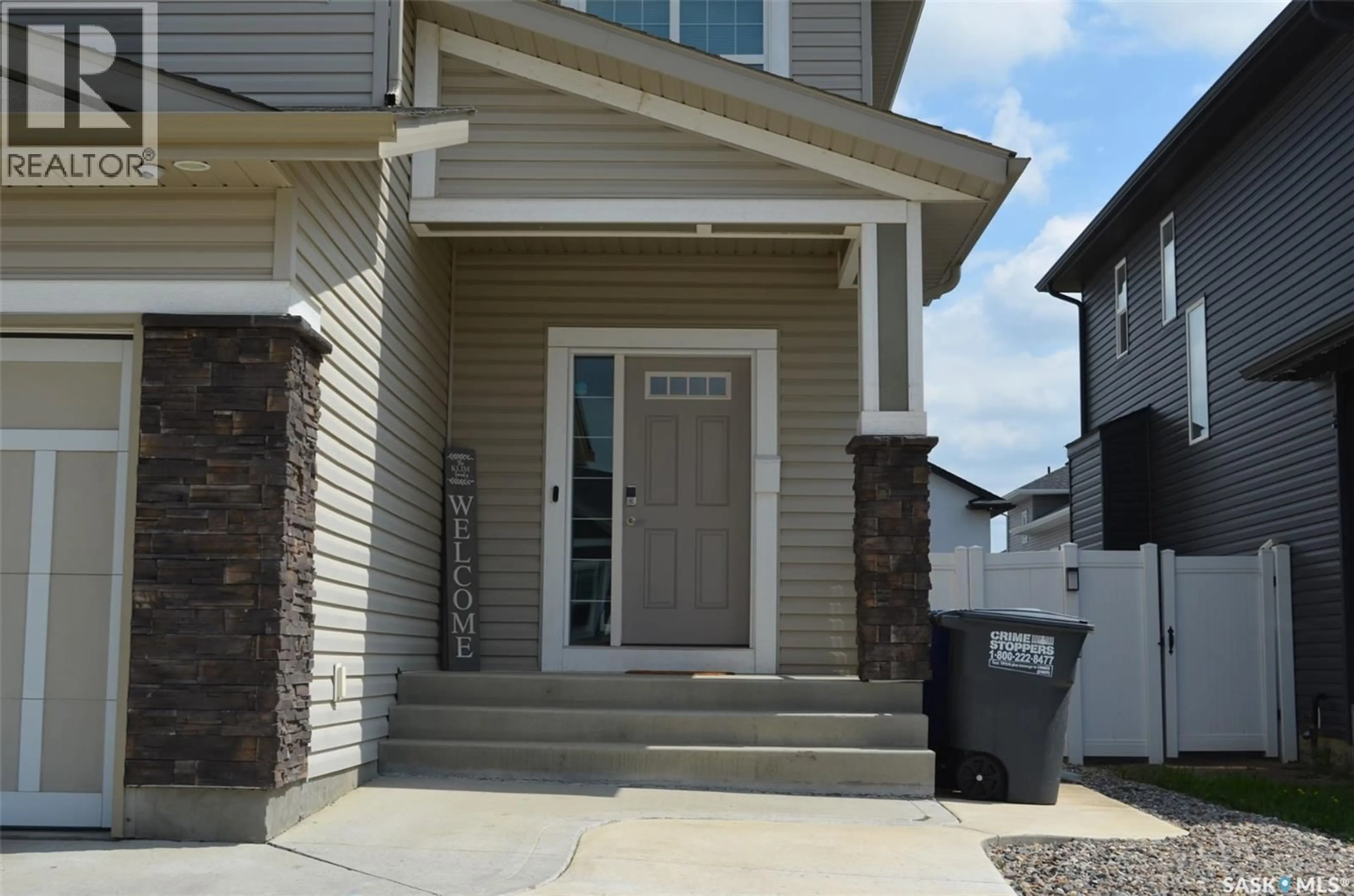 Home with vinyl exterior material, street for 118 STROMBERG CRESCENT, Saskatoon Saskatchewan S7L6M9