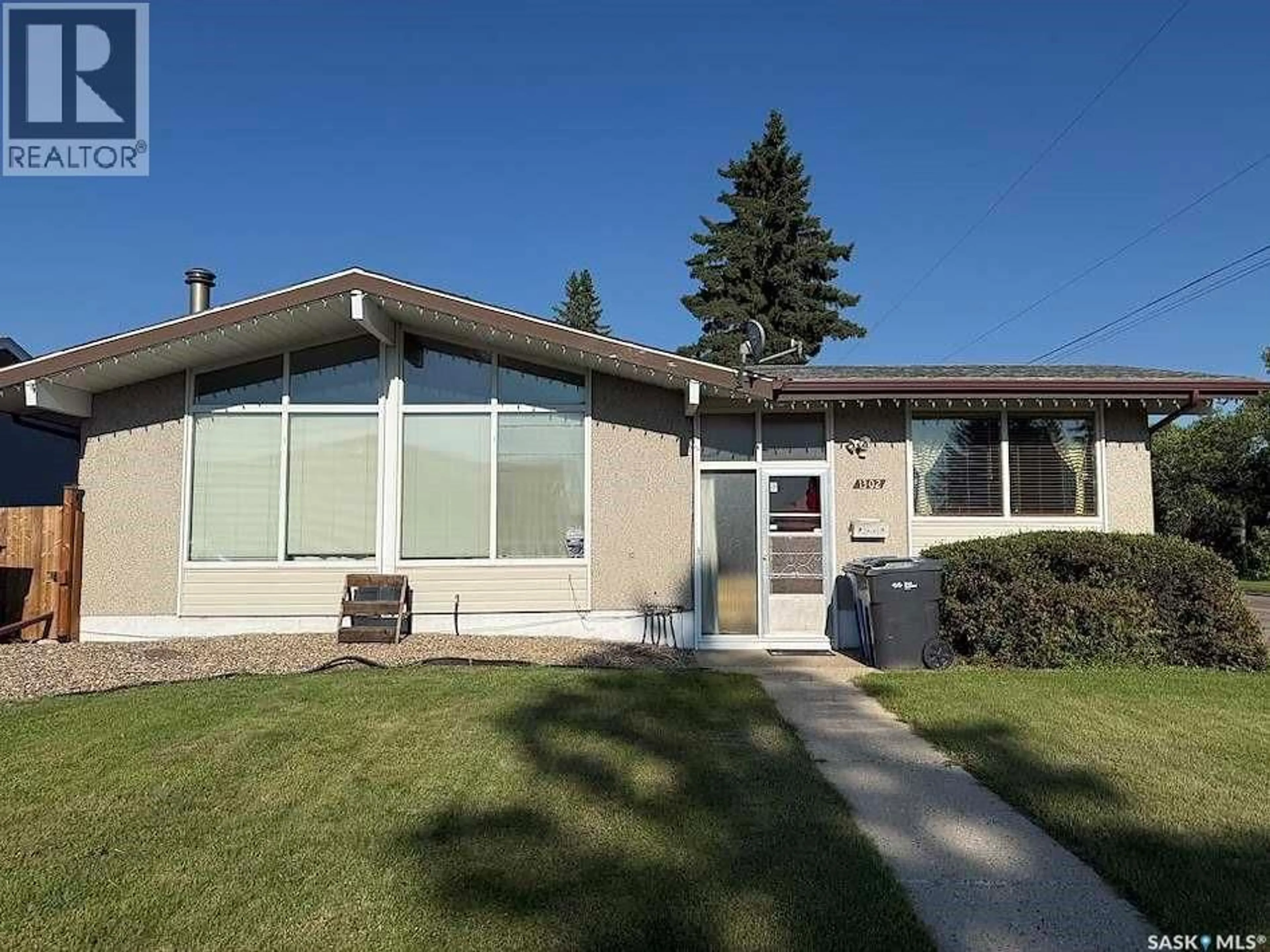 Home with vinyl exterior material, street for 1302 112TH STREET, North Battleford Saskatchewan S9A2L7