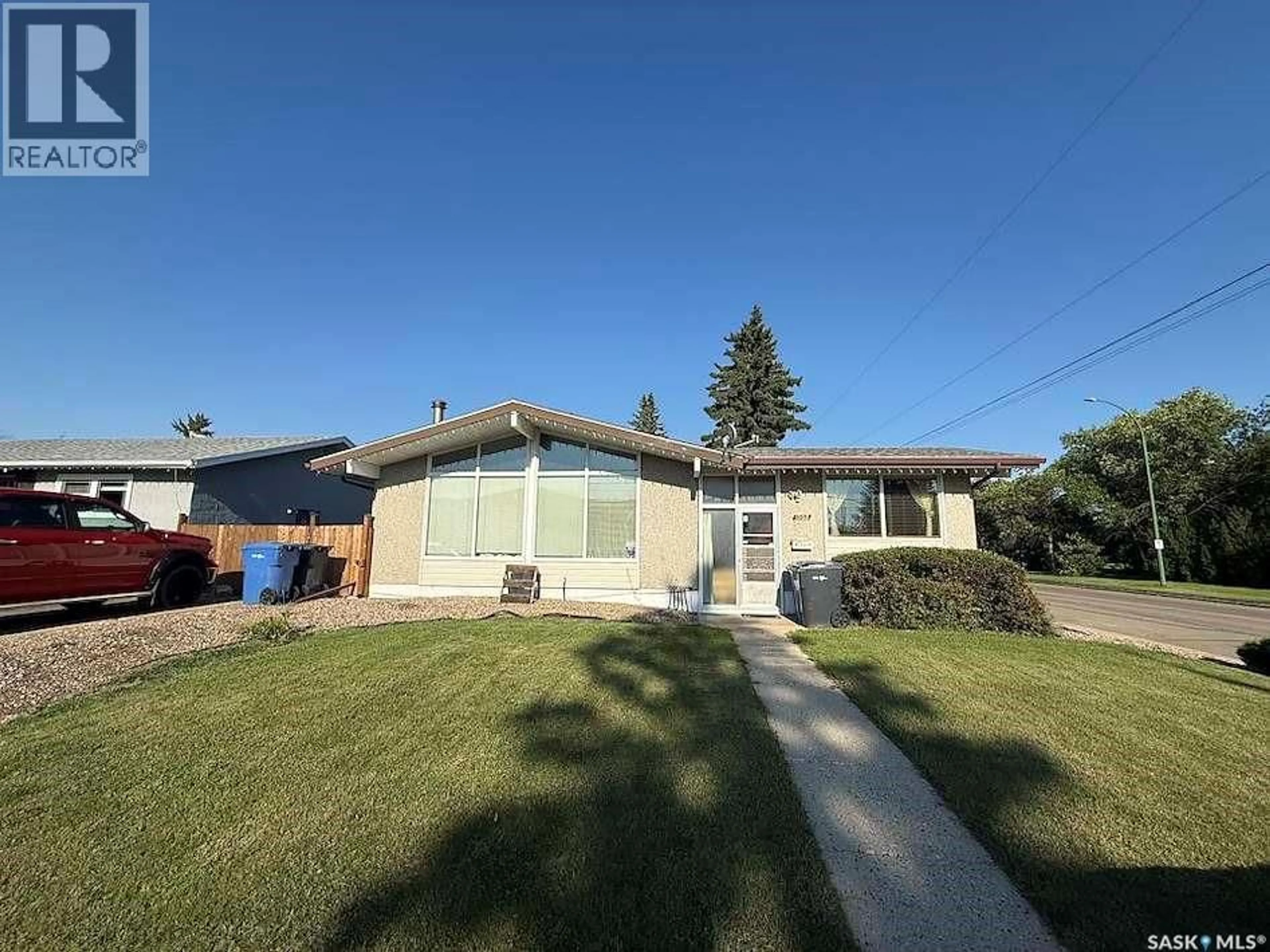 Home with vinyl exterior material, street for 1302 112TH STREET, North Battleford Saskatchewan S9A2L7