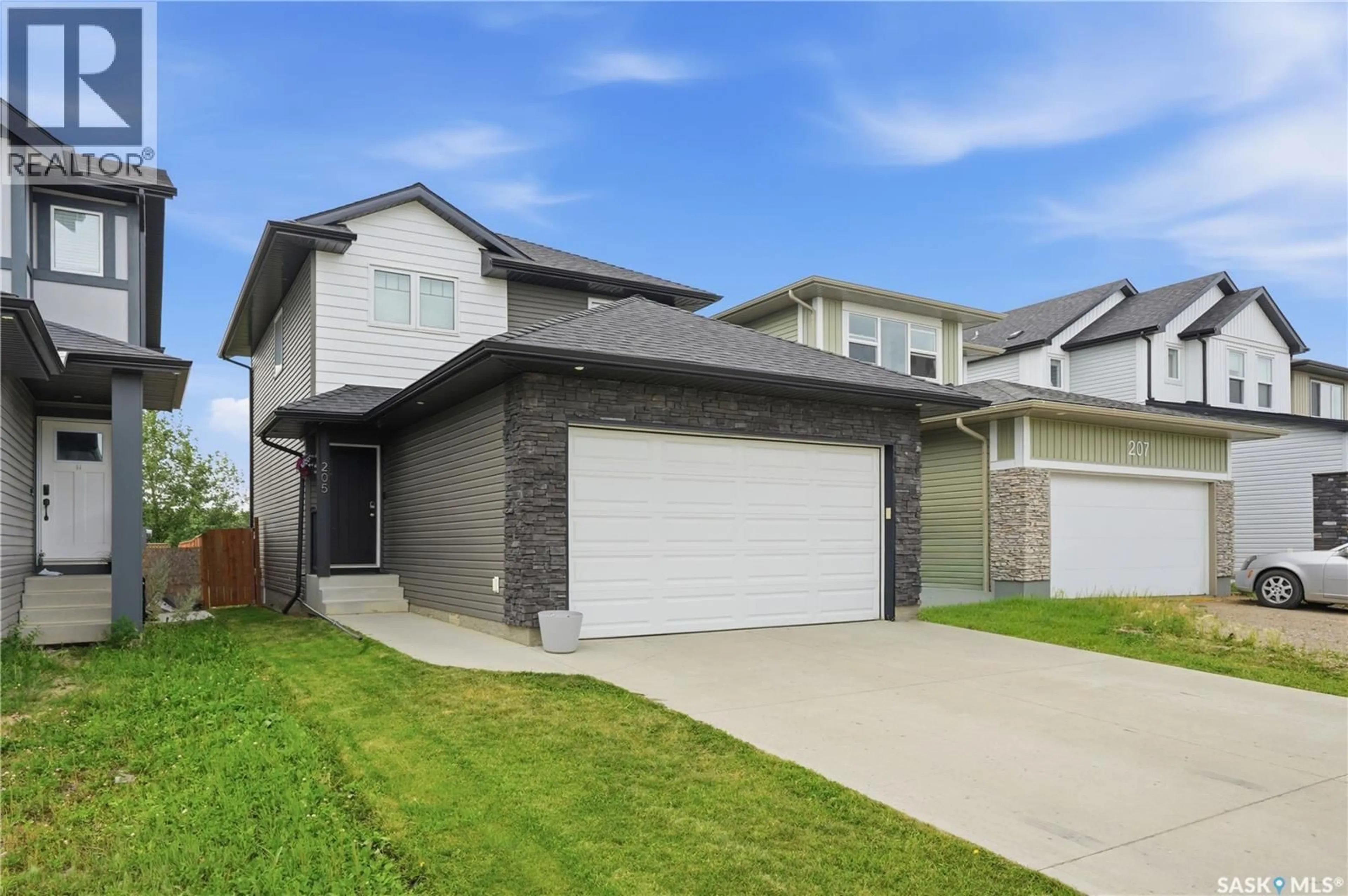 Home with brick exterior material, street for 205 WALL STREET, Dalmeny Saskatchewan S0K1E0